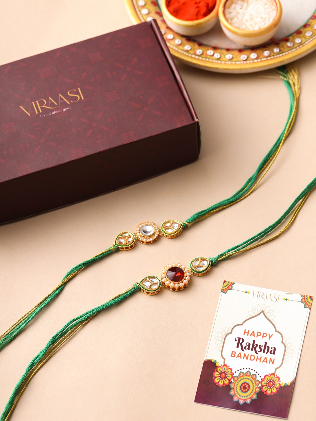 

VIRAASI Men Set Of 2 Gold-Toned Kundan Studded Rakhi With Roli Chawal