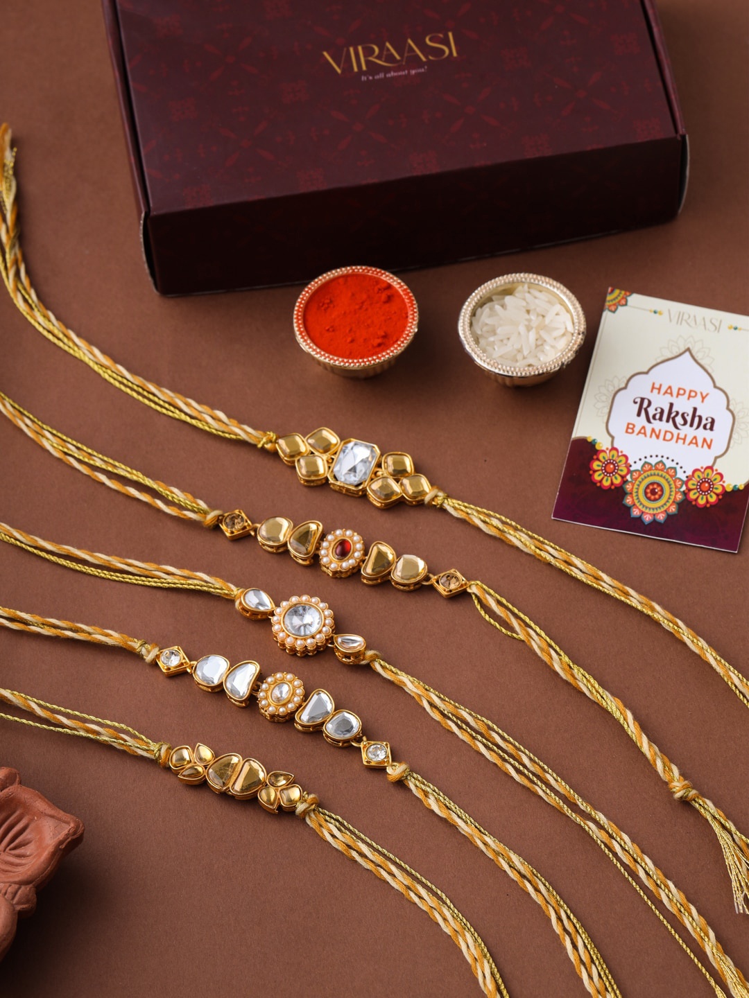 

VIRAASI Men Set of 5 Gold-Toned kundan Studded Rakhi