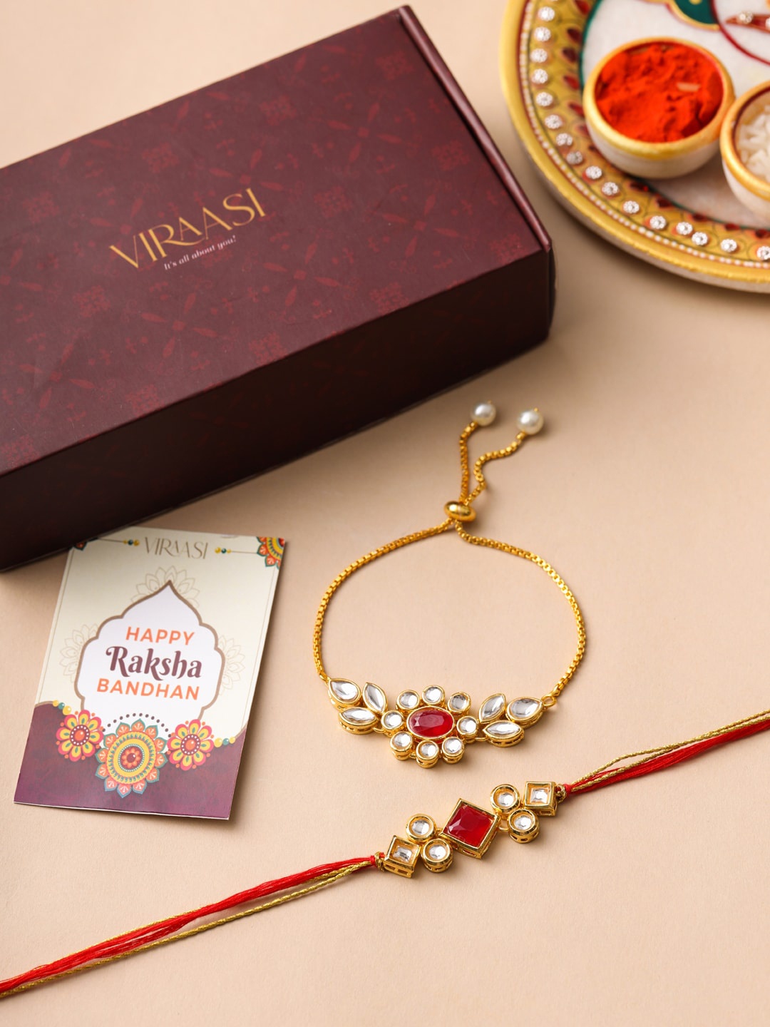 

VIRAASI Gold Toned Kundan Bhaiya Bhabhi Rakhi Bracelet with Roli Chawal