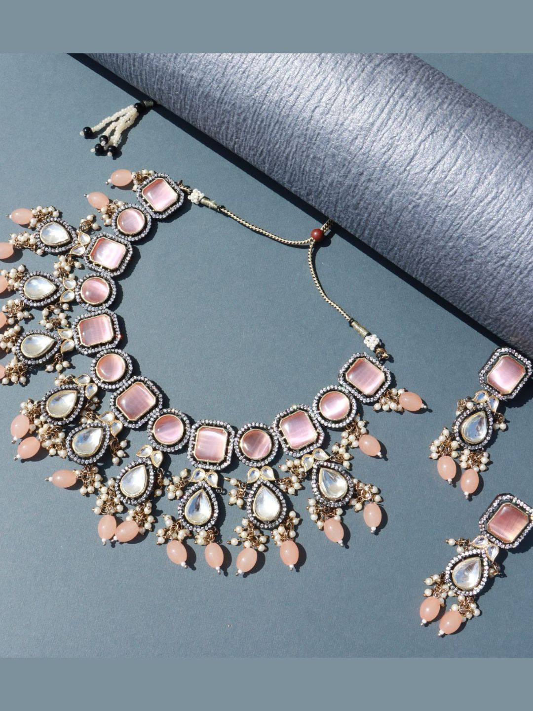 

I Jewels Gold-Plated Peach-coloured Kundan Studded Beaded Jewellery Set