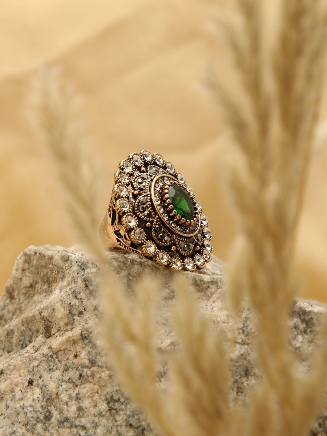 

SOHI Women Gold-Plated White & Green Stone Studded Finger Ring