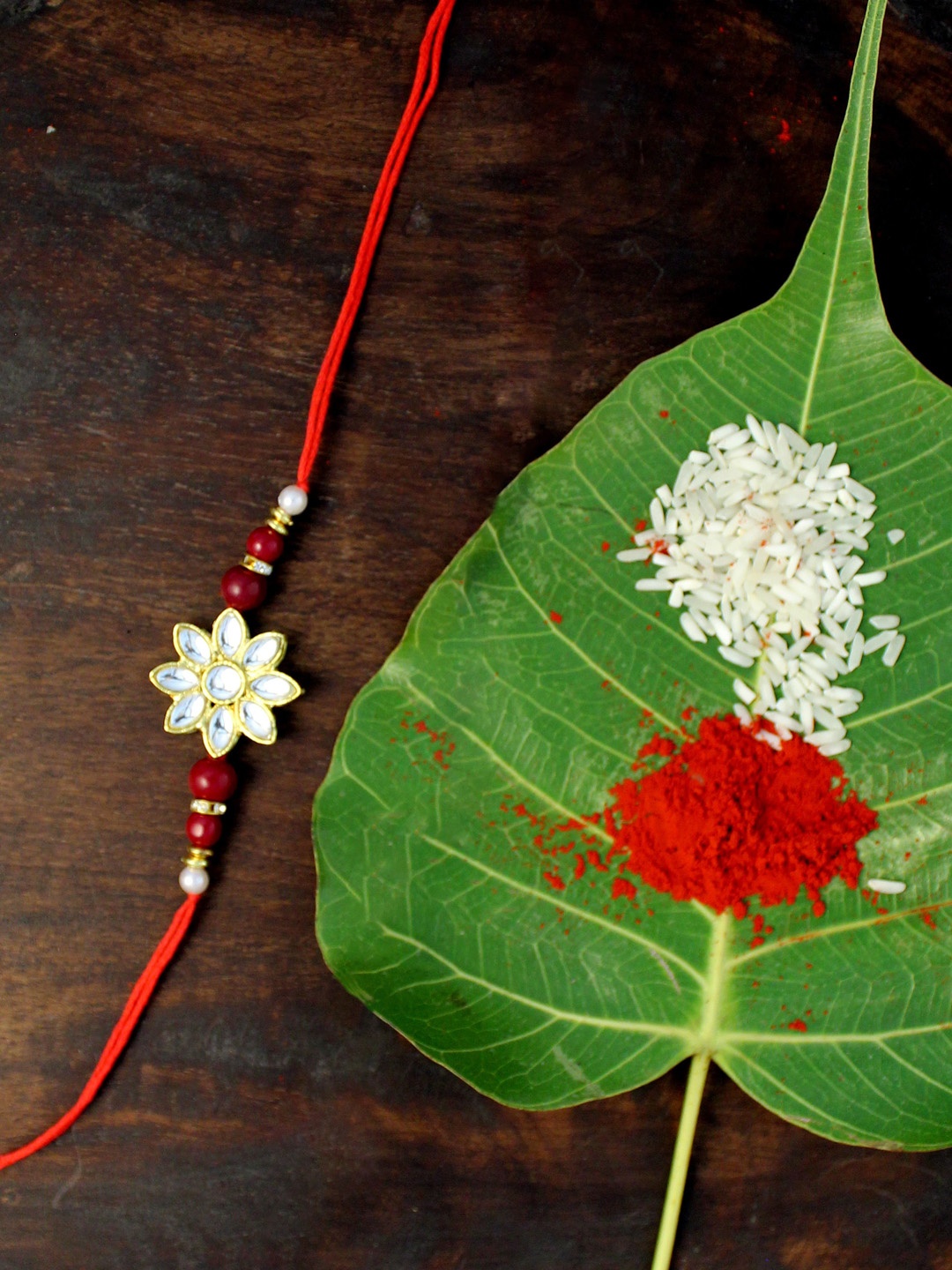 

KARATCART Red Gold-Plated Kundan Rakhi Set