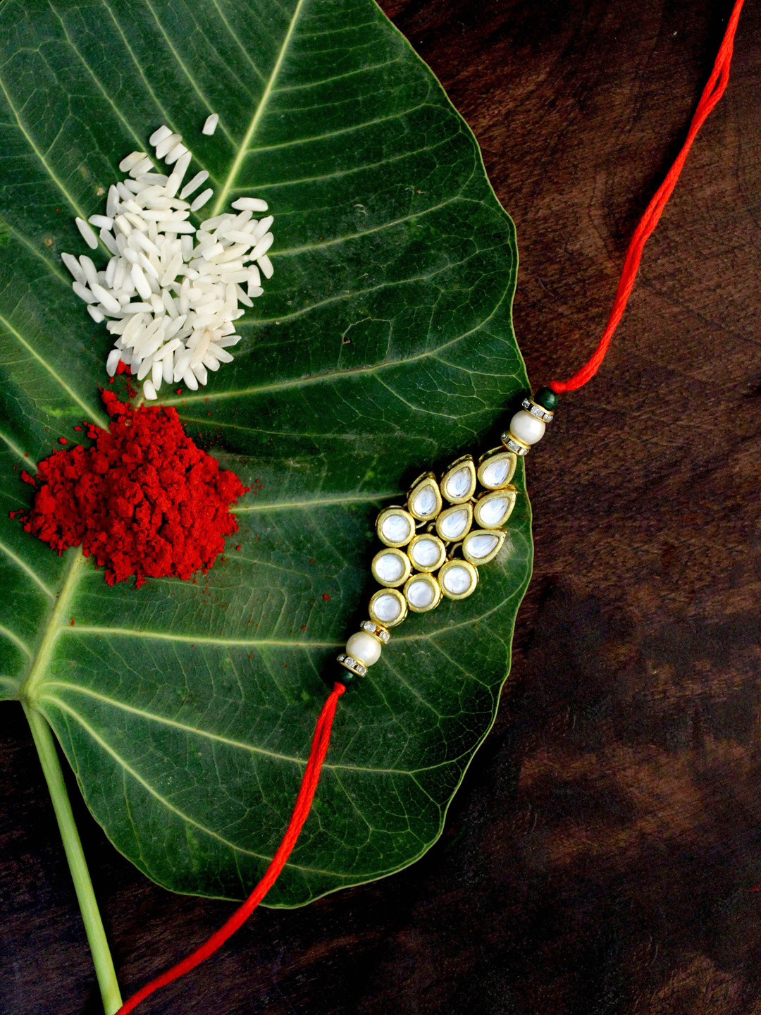 

KARATCART Men Gold-Plated White & Green Kundan-Studded & Beaded Rakhi