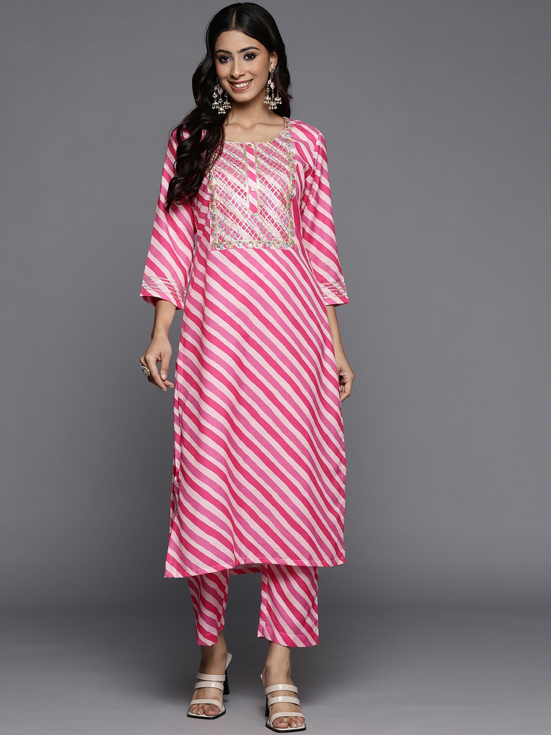 

Varanga Women Fuchsia Pink & White Leheriya Striped Gotta Patti Kurta with Trousers