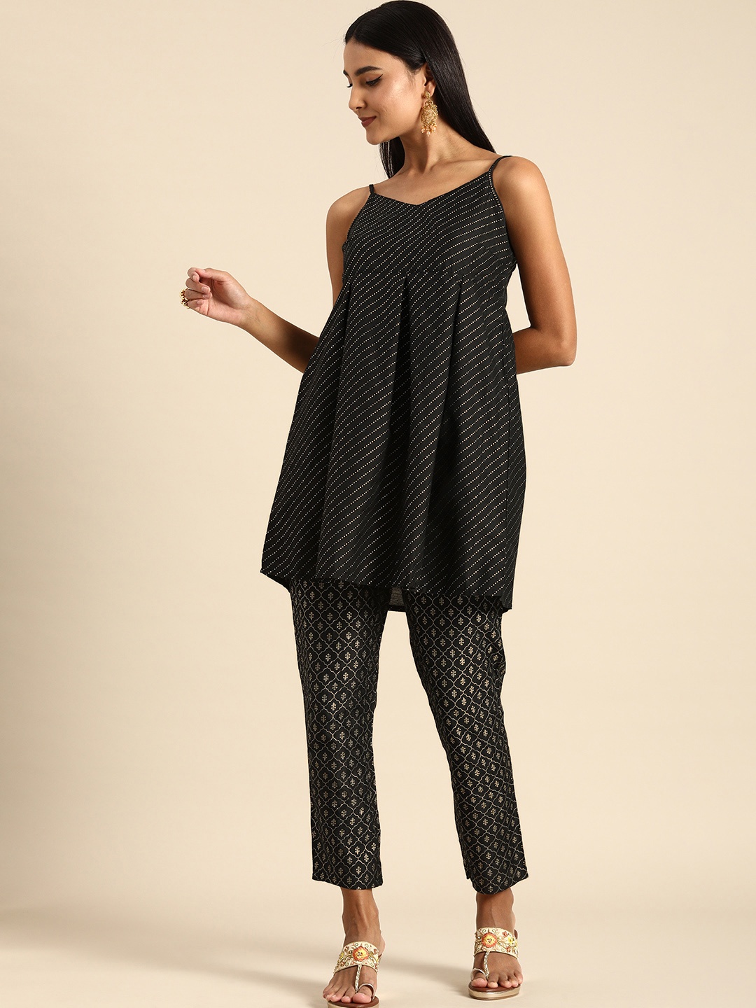 

Anouk Women Black Striped Empire Style Kurti with Printed Trousers