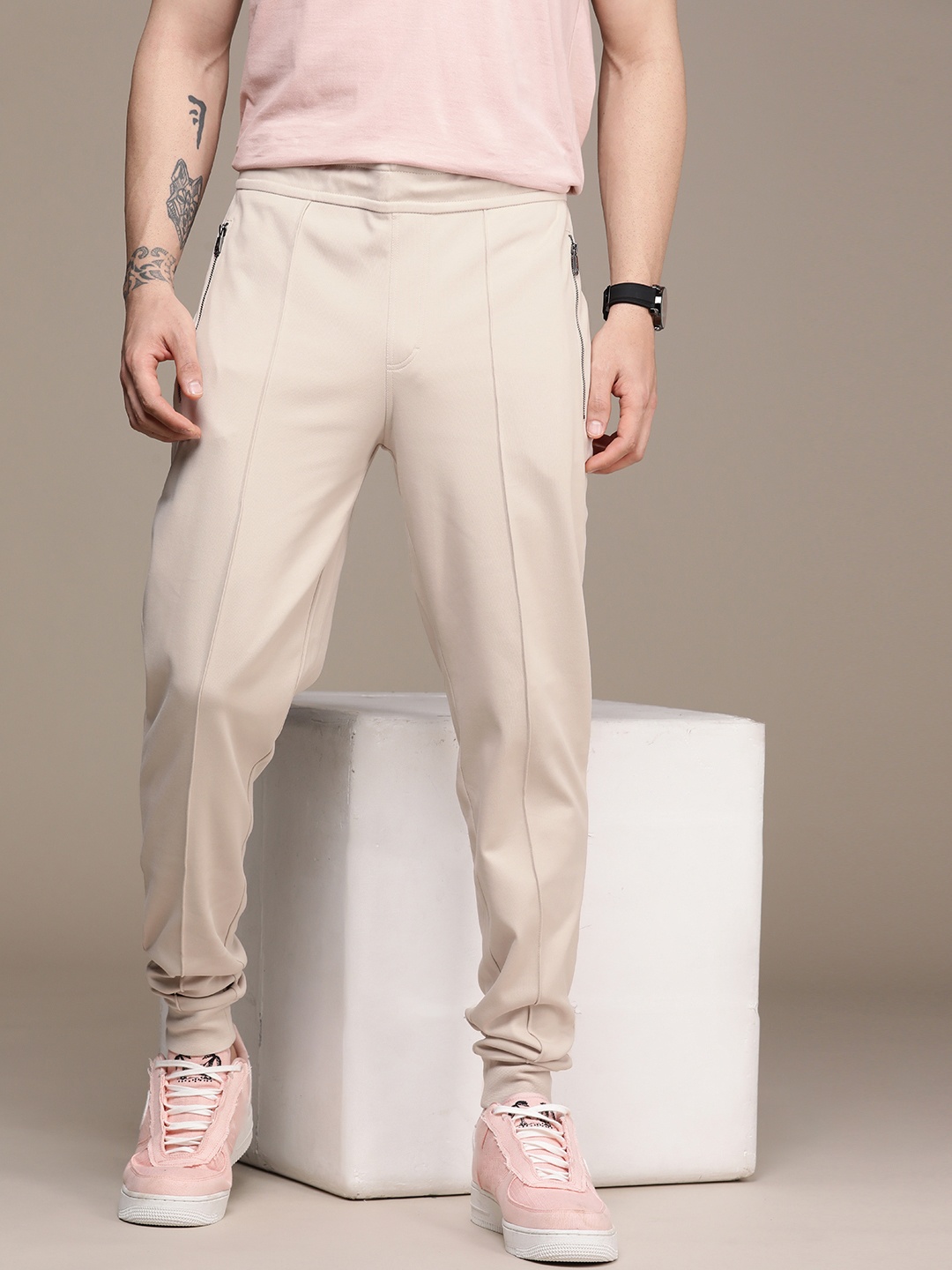 

Calvin Klein Jeans Cream Solid Mid Rise Casual Joggers, Beige