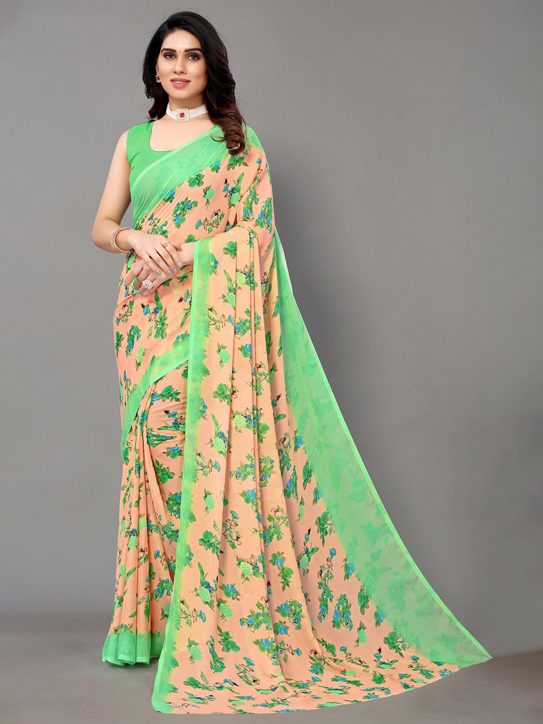 

Yashika Orange & Green Floral Saree