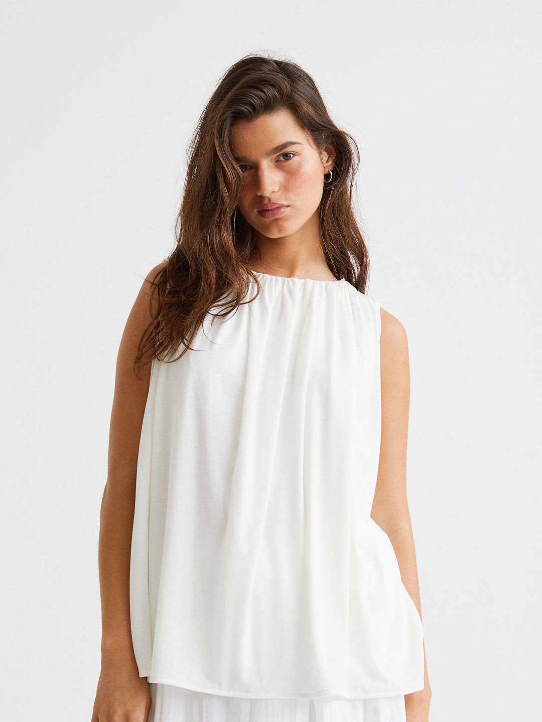 

H&M White Solid Sleeveless Blouse
