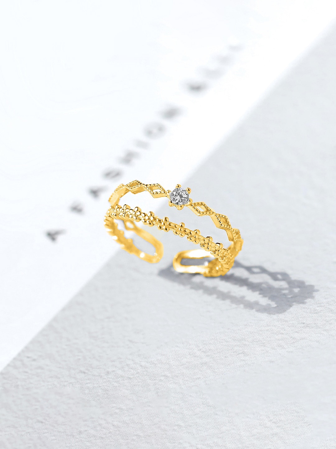 

Unwind by Yellow Chimes Gold-Plated White Multilayered Studded Ring