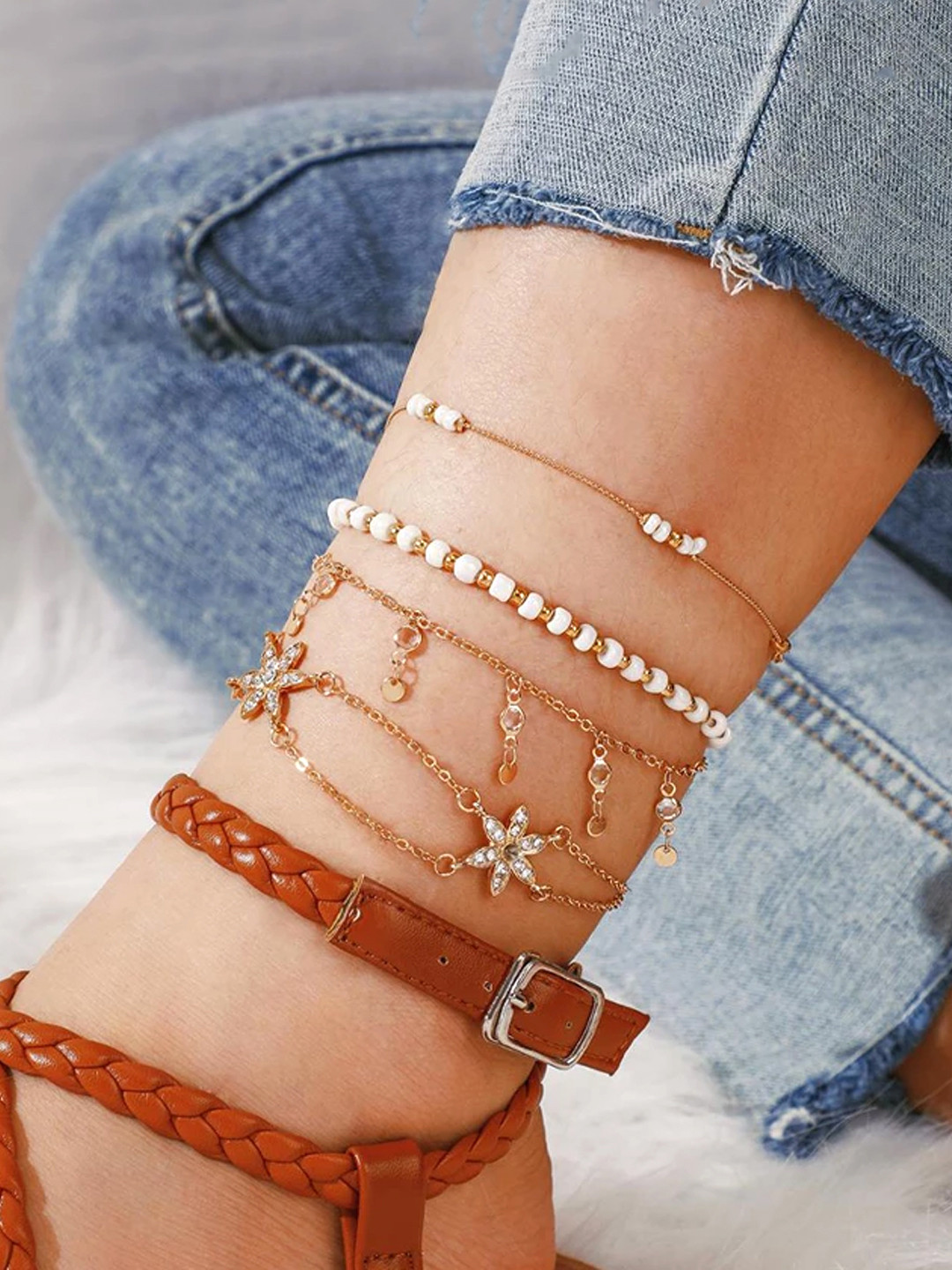 

Unwind by Yellow Chimes Set Of 4 Gold-Plated & Gold Toned White Studded & Beaded Anklet