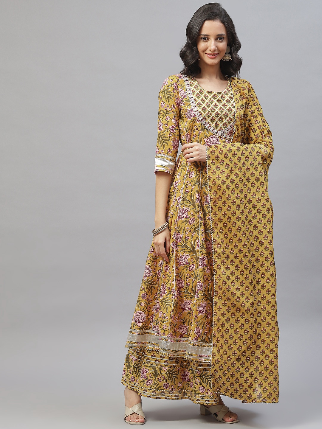 

Divena Women Mustard Yellow Floral Printed Panelled Gotta Patti Pure Cotton Kurta with Palazzos & With