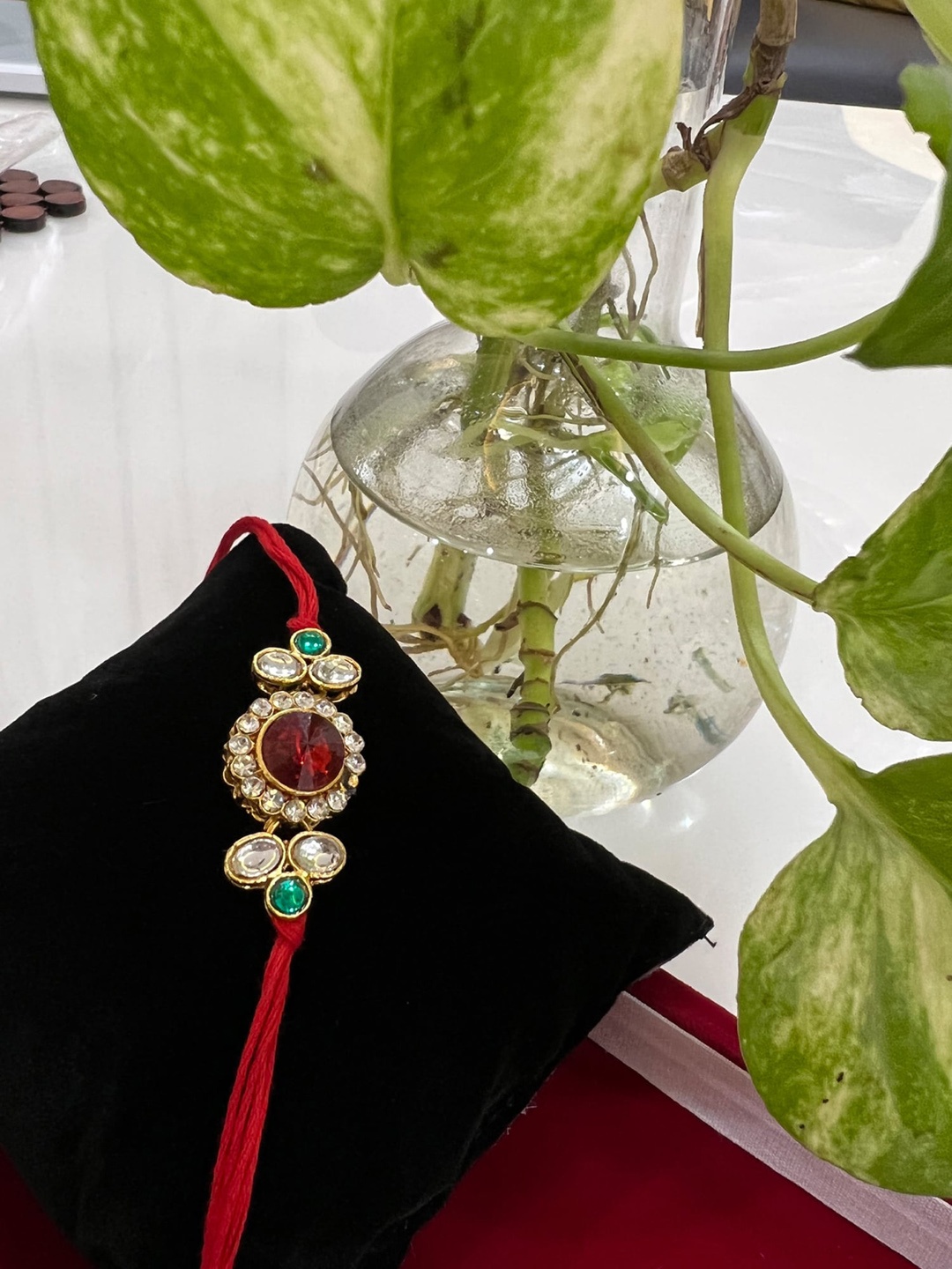 

Vembley Gold Toned & White Kundan Studded Thread Rakhi