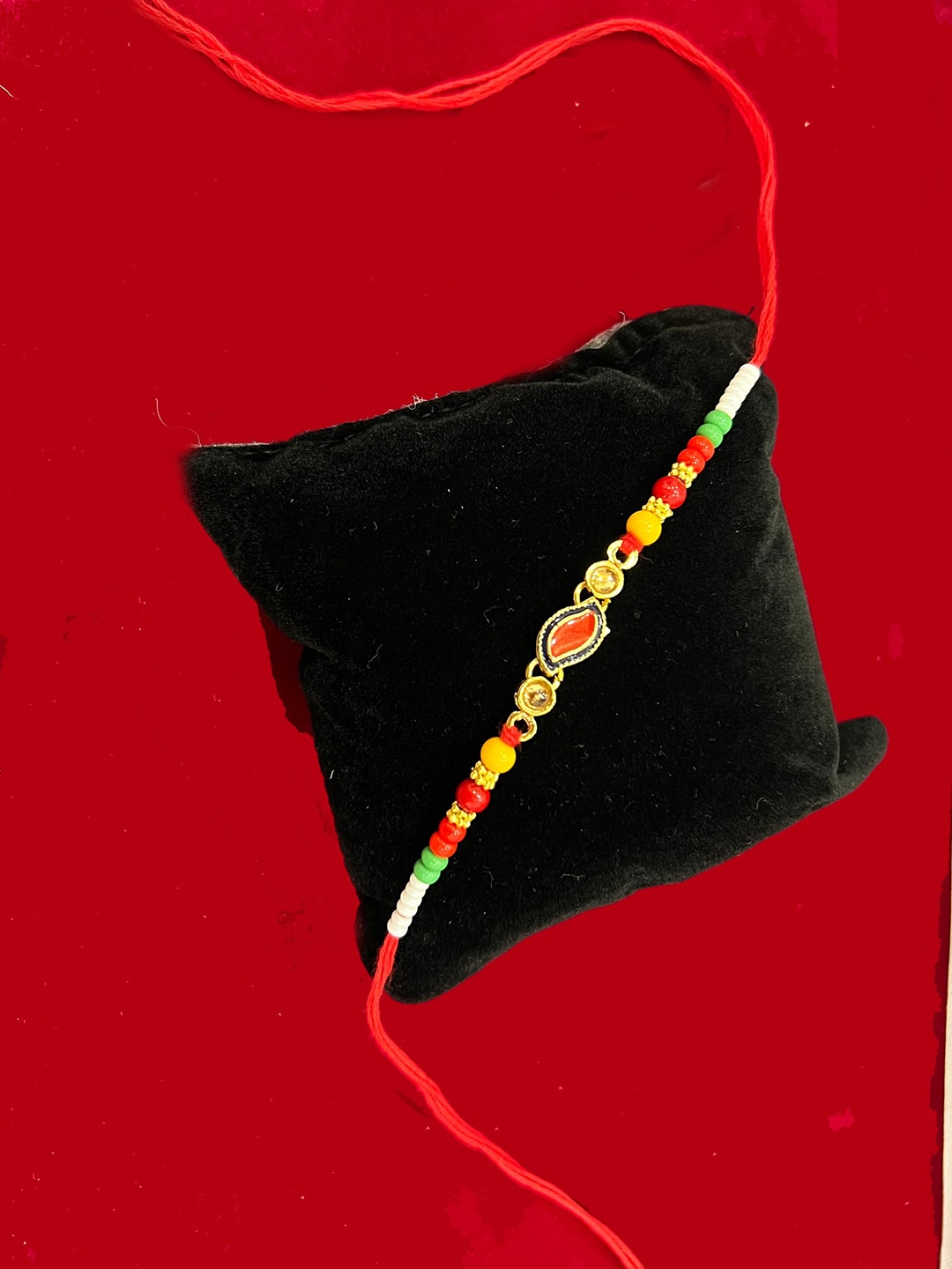

Vembley Red & Gold-Toned Stone-Studded Rakhi