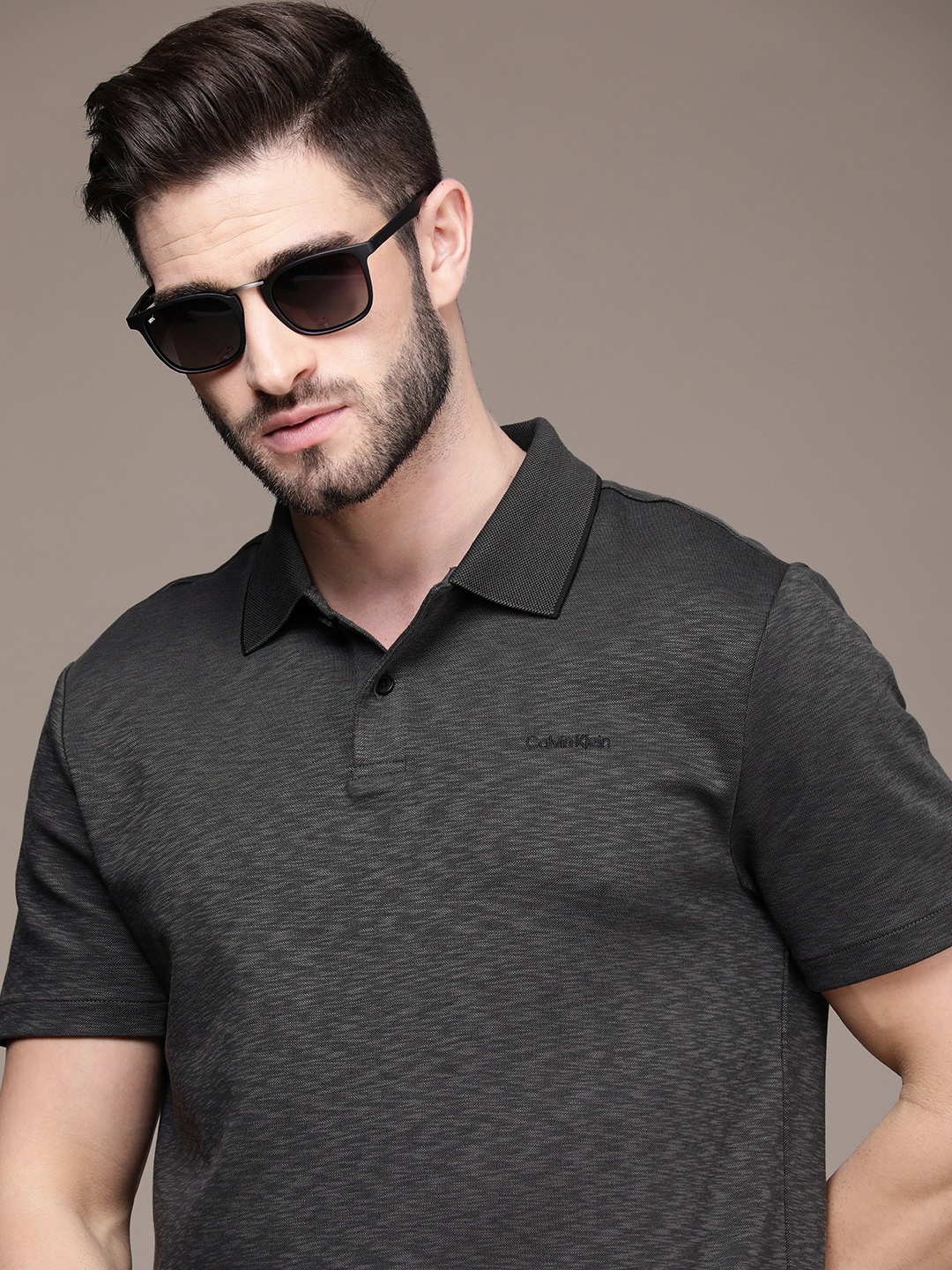 

Calvin Klein Jeans Men Charcoal Grey Self Design Polo Collar Casual T-shirt