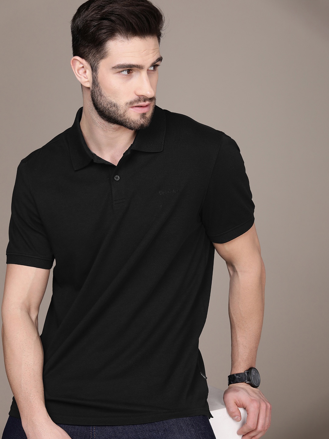 

Calvin Klein Jeans Men Black Solid Pure Cotton Polo Collar T-shirt