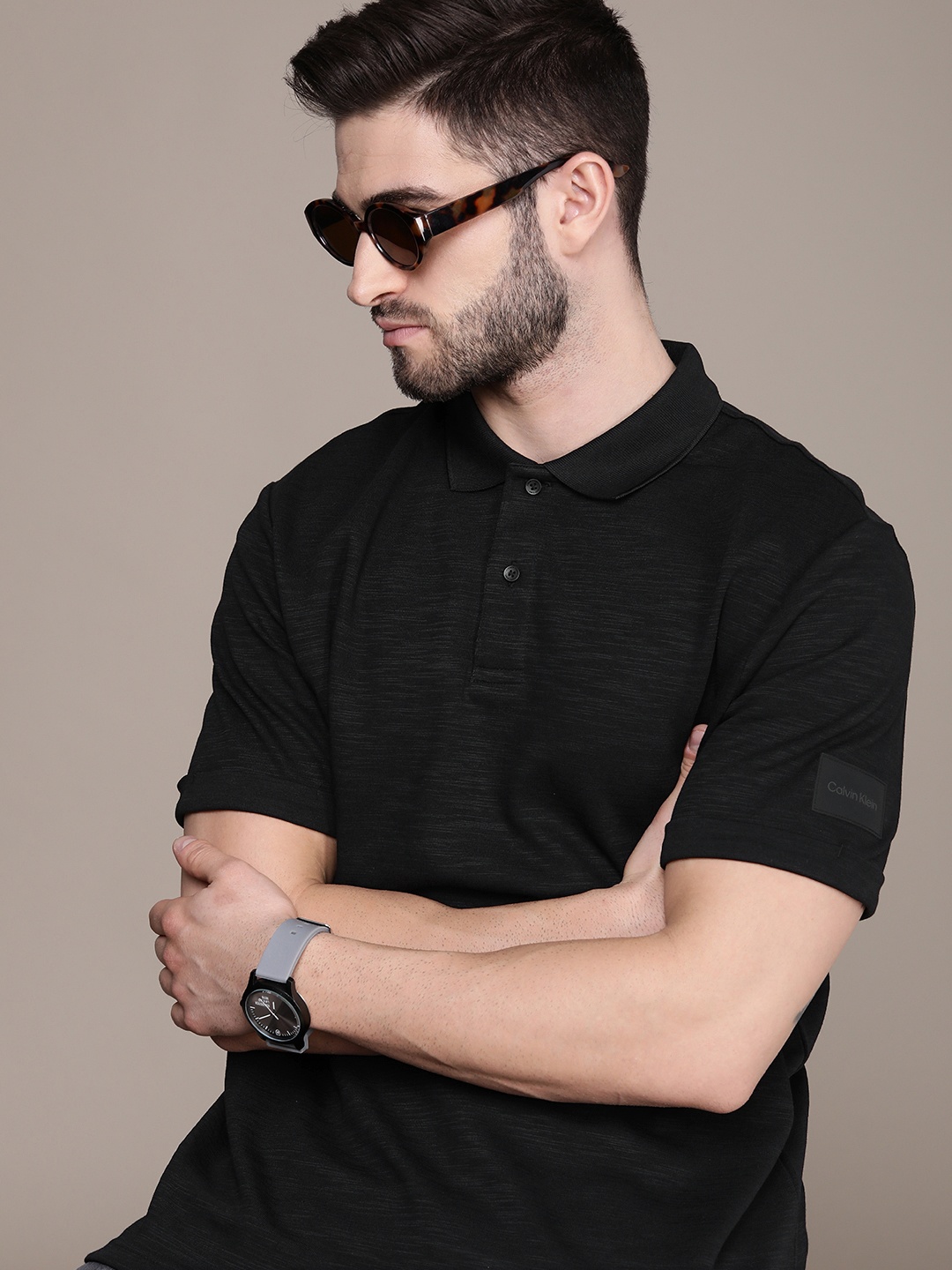 

Calvin Klein Jeans Men Black Self Design Polo Collar Casual T-shirt