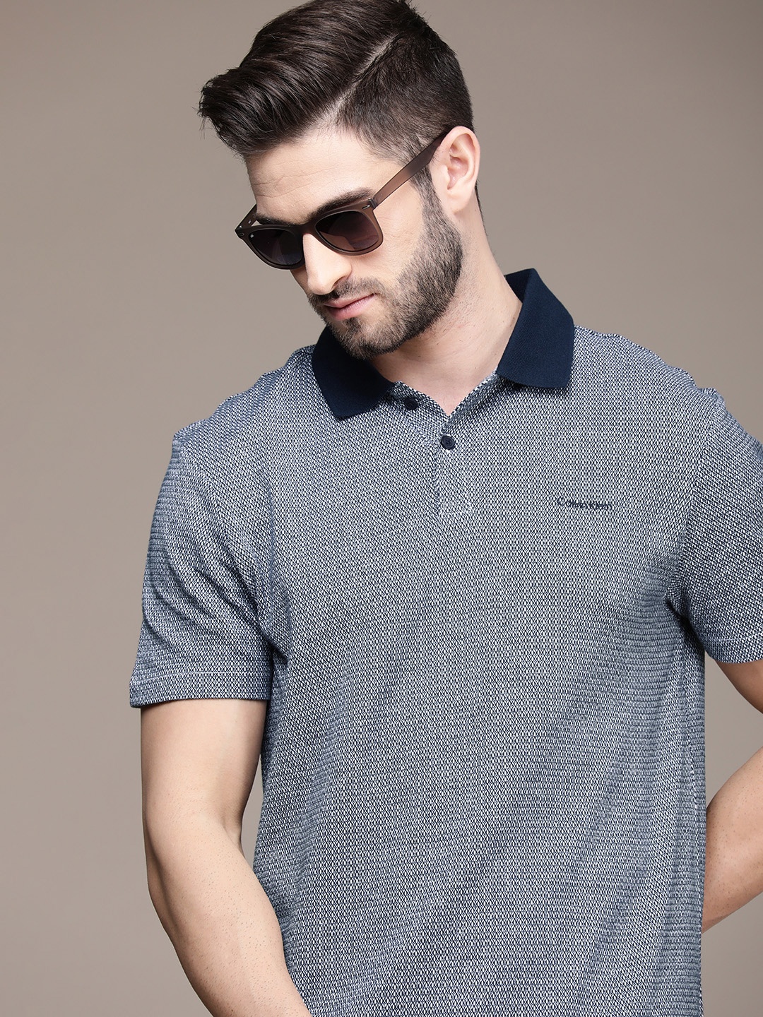 

Calvin Klein Jeans Men Navy Blue Textured Polo Collar Pure Cotton Casual T-shirt