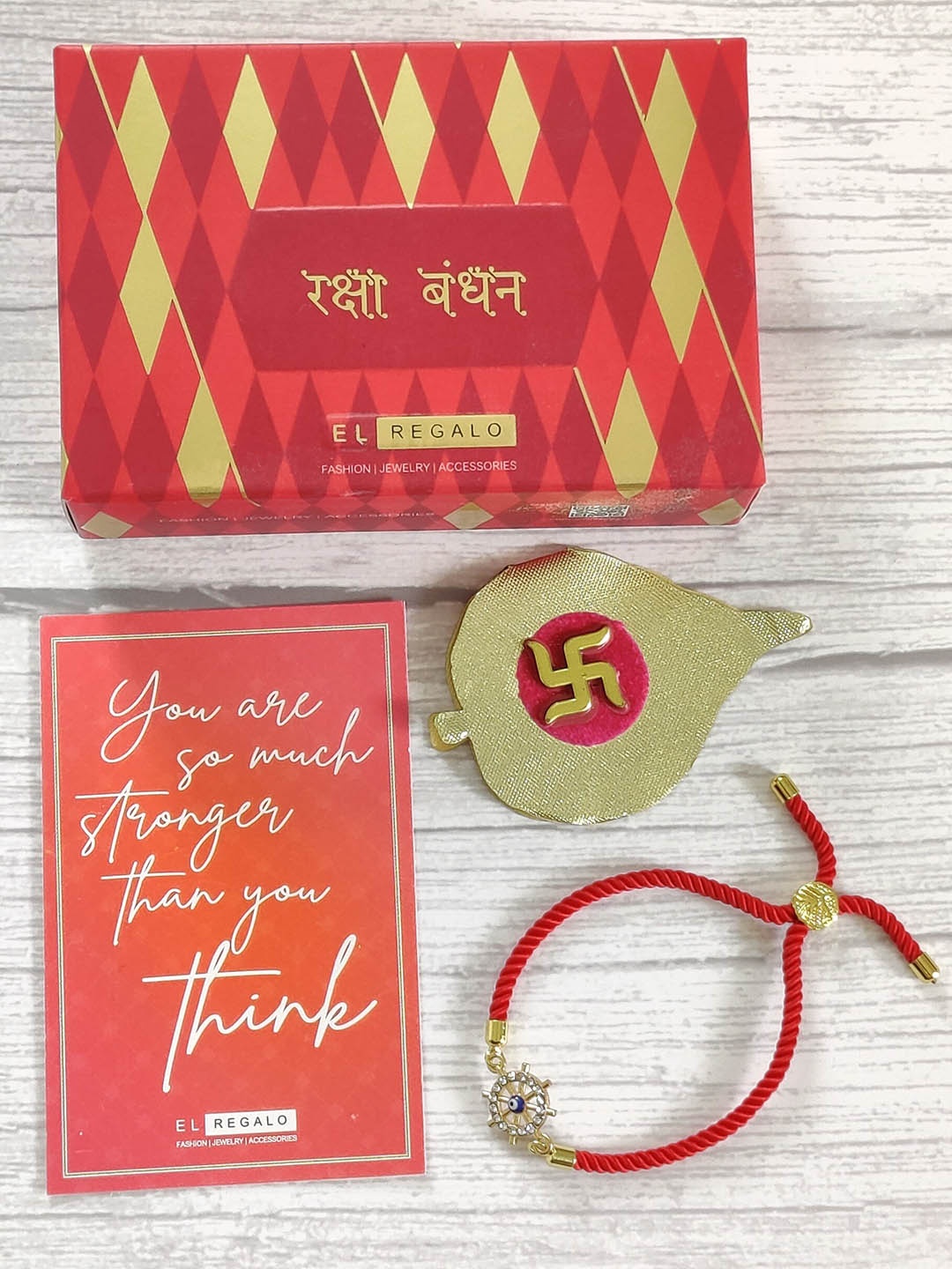 

EL REGALO Red & Gold-Toned Rakhi & Greeting card and Roli Chawal Set