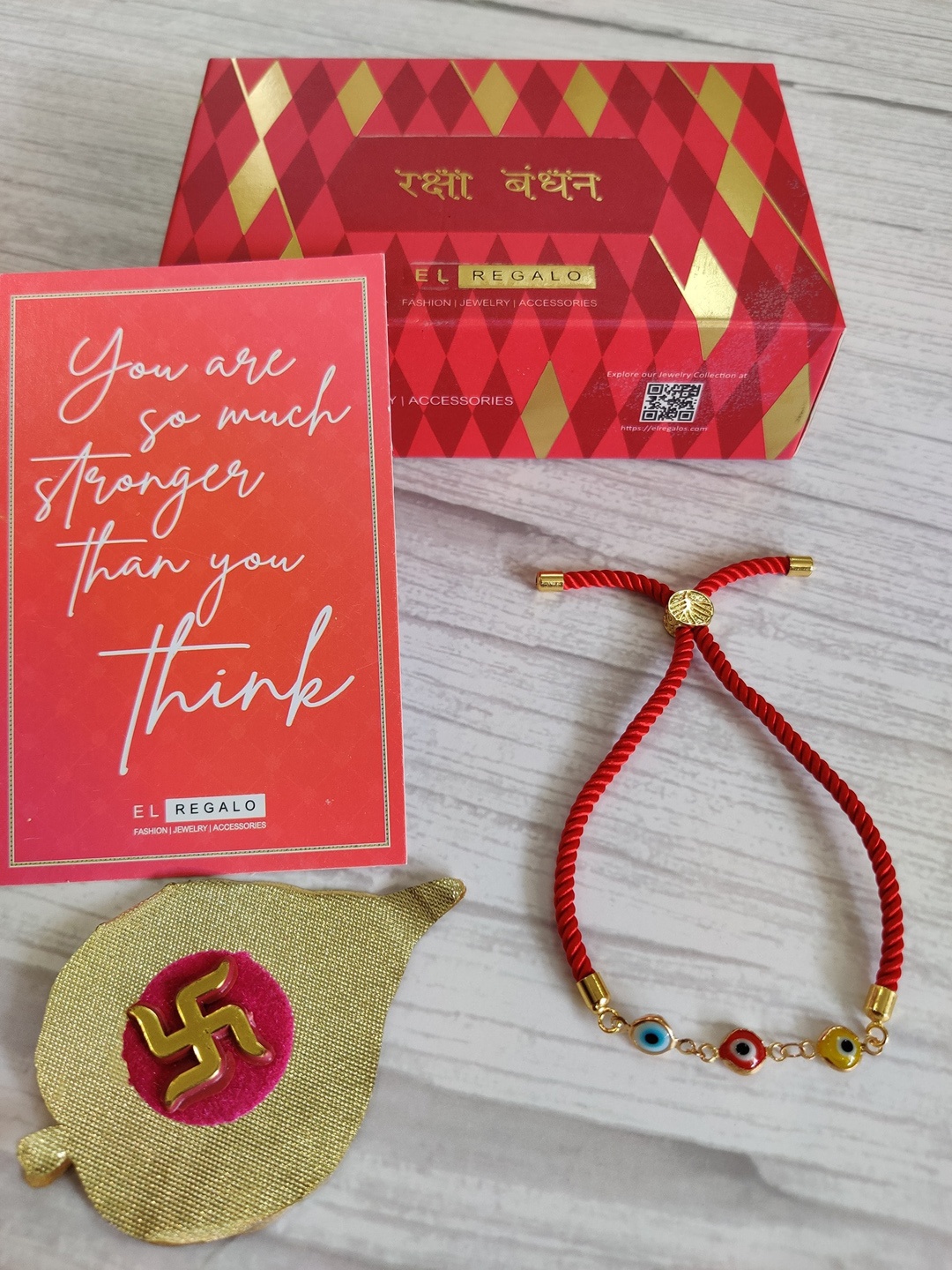 

EL REGALO Unisex Gold-Toned & Red Evil Eye Rakhi