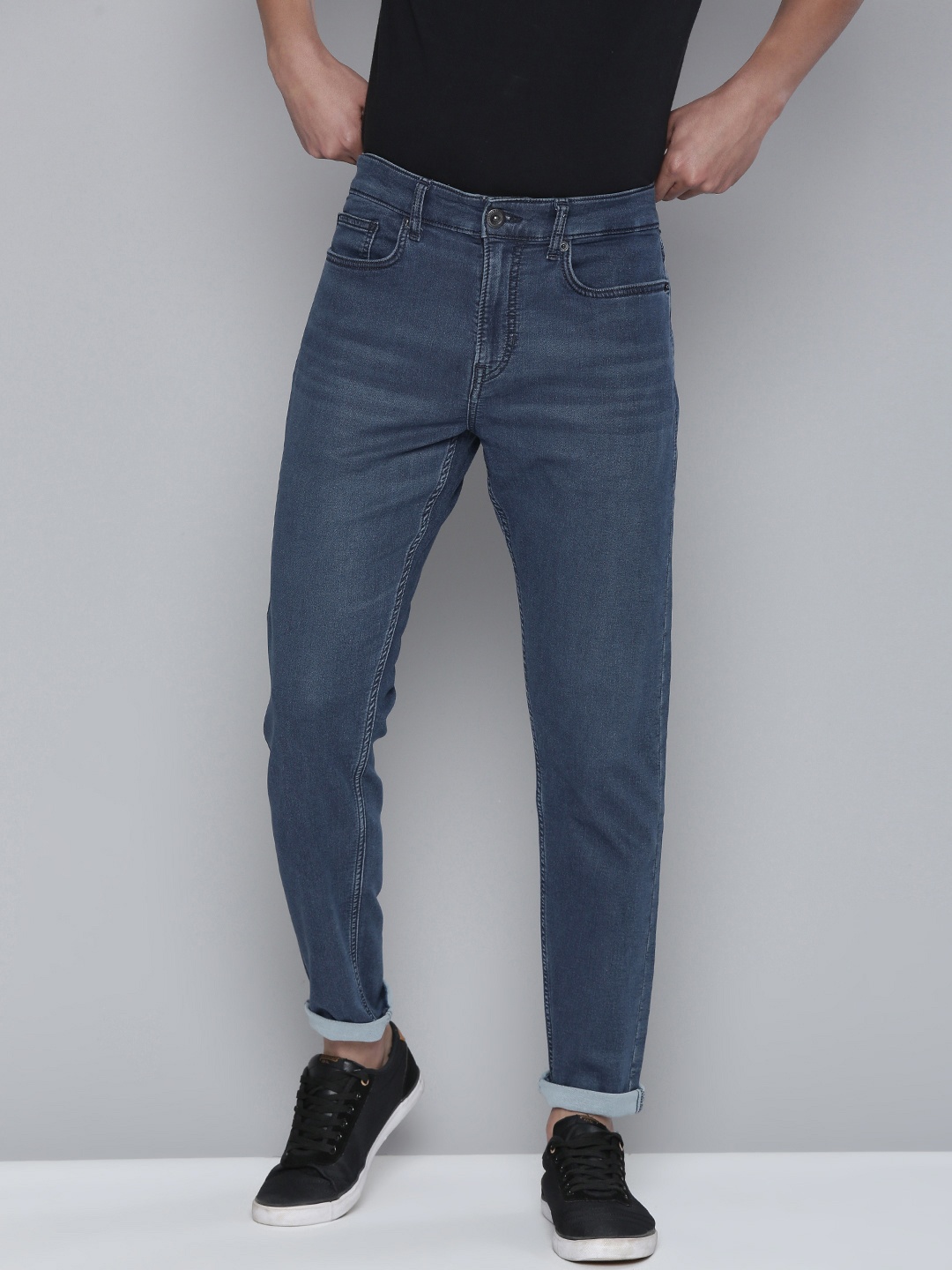 

Flying Machine Men Blue Slash Slim Tapered Fit Mid Rise Light Fade Stretchable Jeans