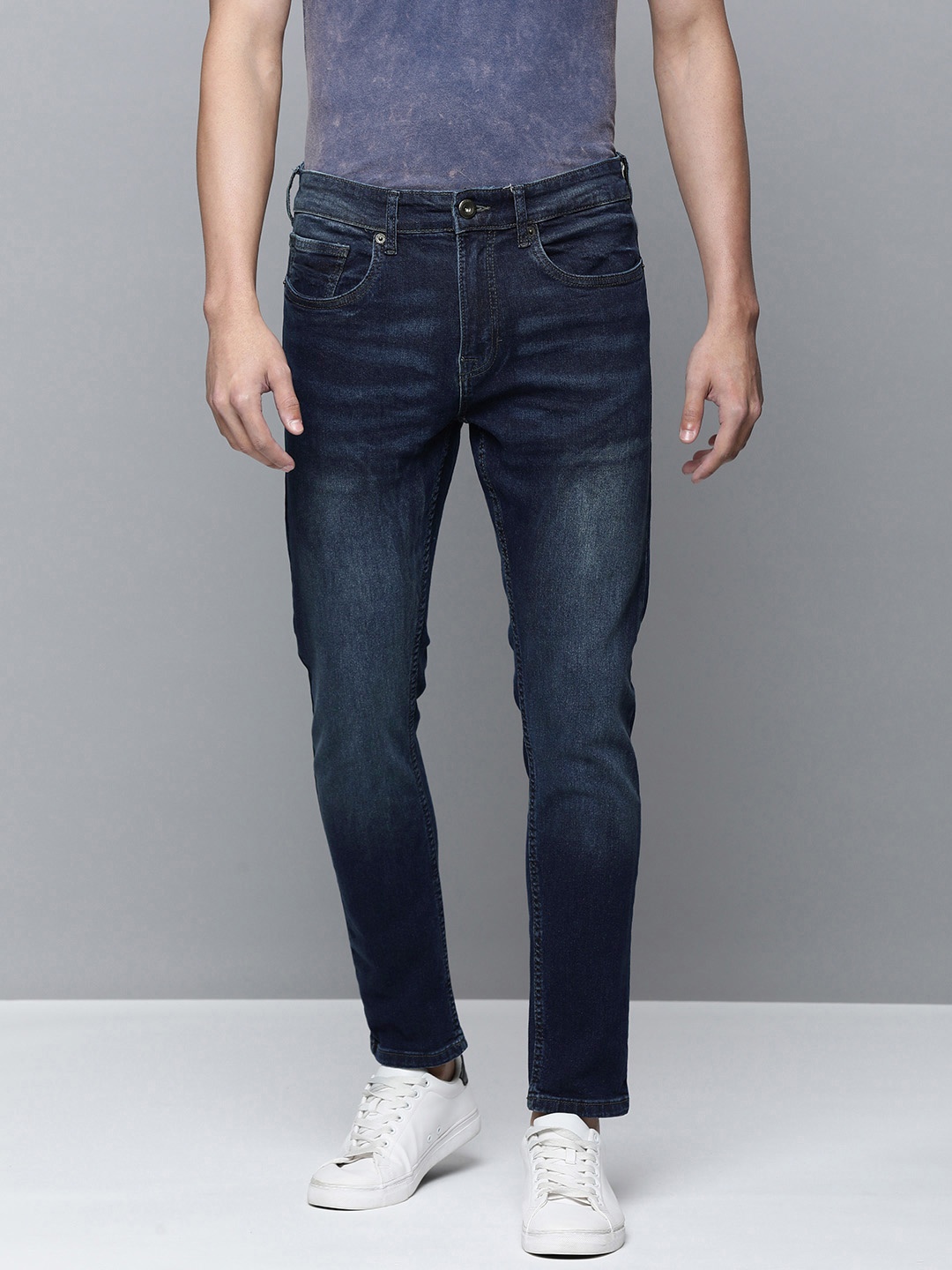 

Flying Machine Men Blue Slim Tapered Fit Mid-Rise Clean Look Light Fade Stretchable Jeans
