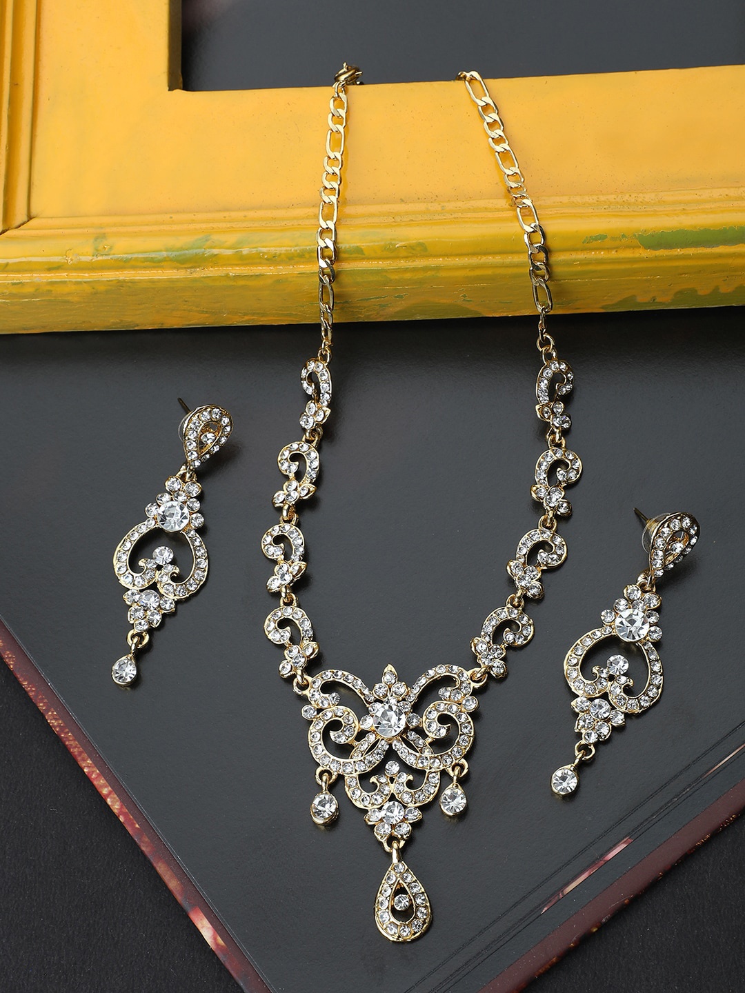 

ANIKAS CREATION Gold-Plated & White AD-Studded Antique Jewellery Set