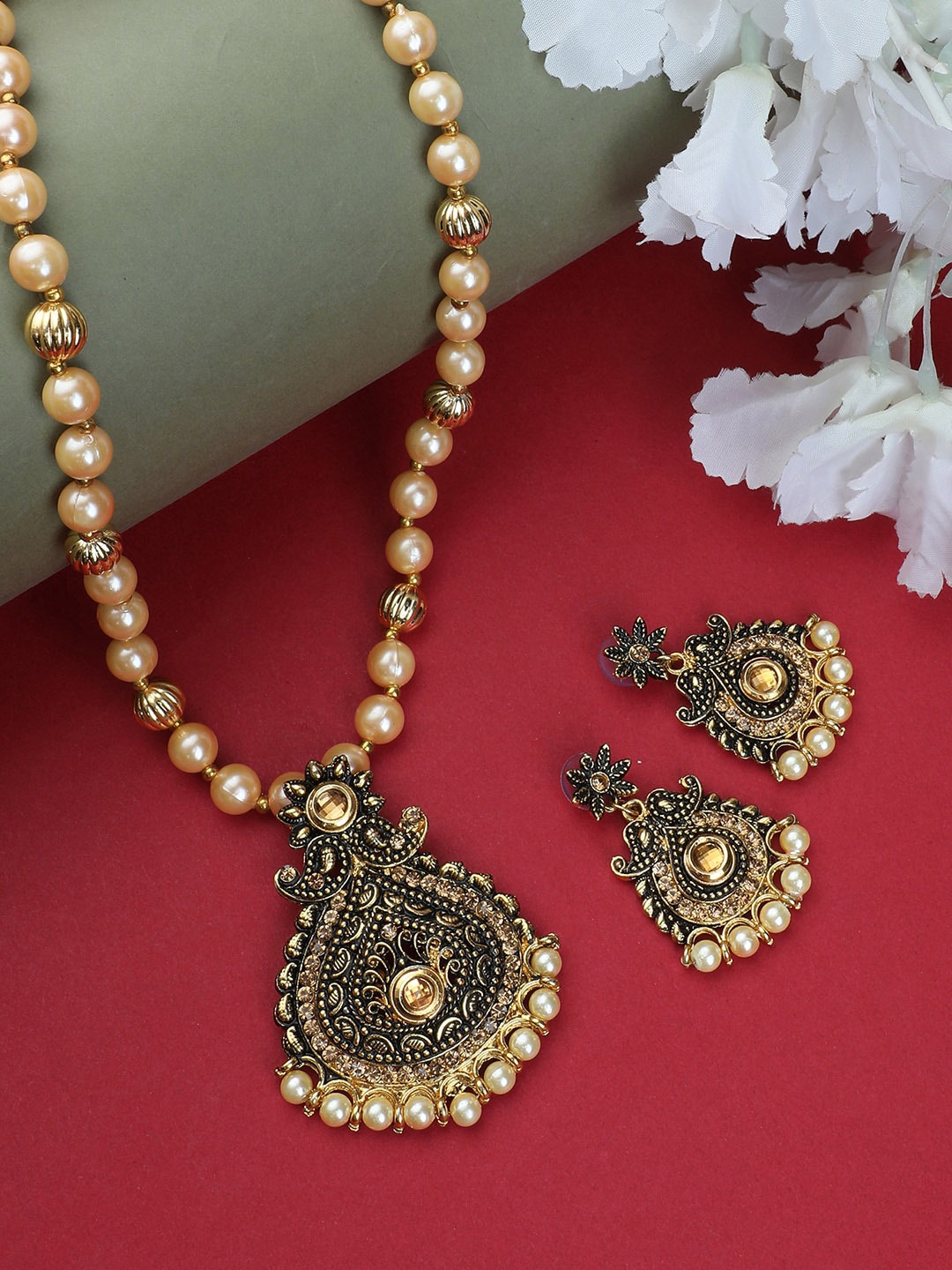 

ANIKAS CREATION Gold-Plated Black Enamelled Stone Studded Pearl Beaded Jewellery Set