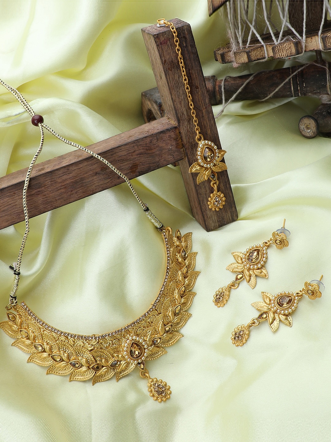 

ANIKAS CREATION Gold-Plated Beige Stone-Studded Jewellery Set