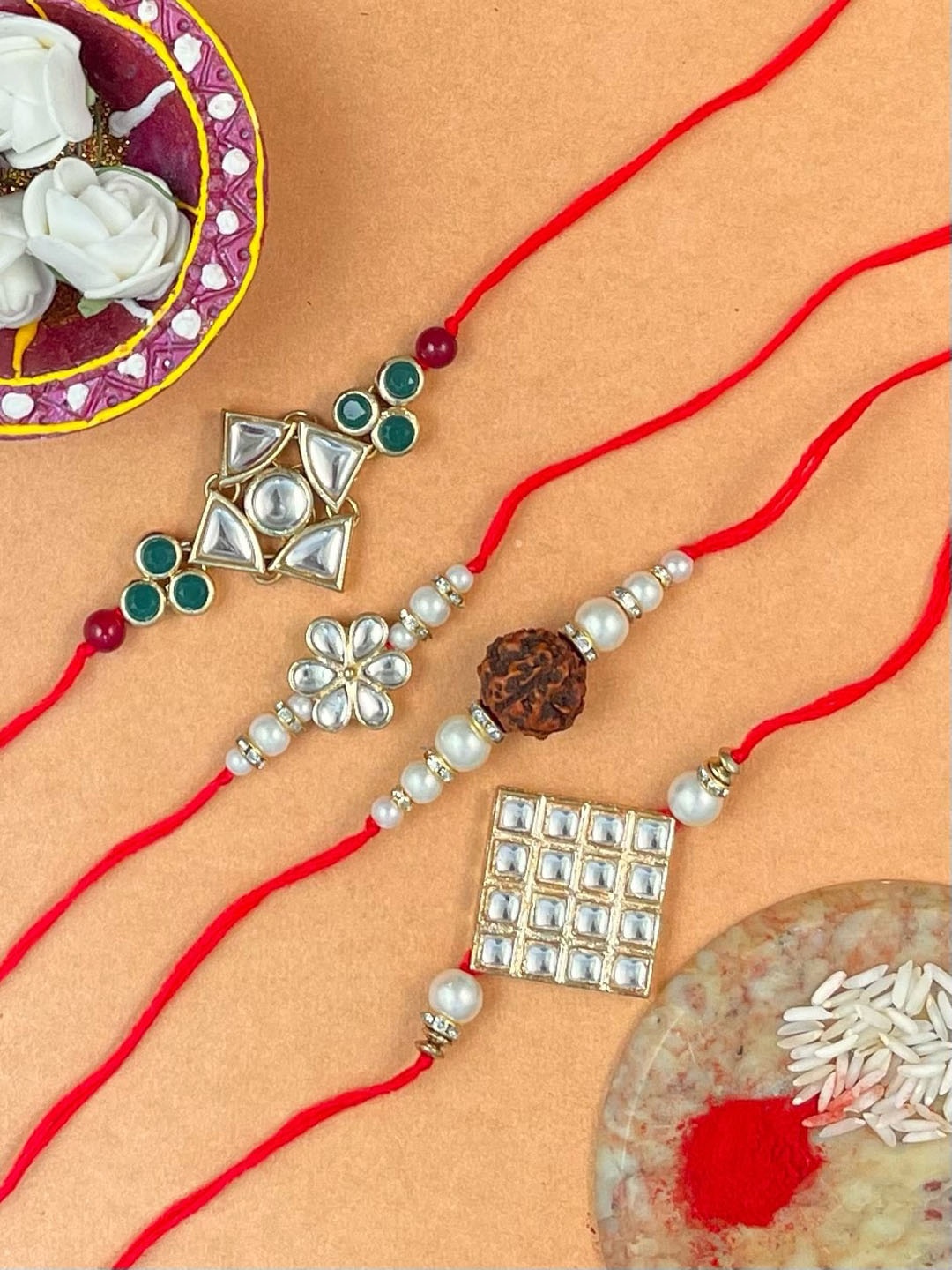 

KARATCART Men Set Of 4 Gold-Plated Kundan Studded Rakhi With Roli & Chawal