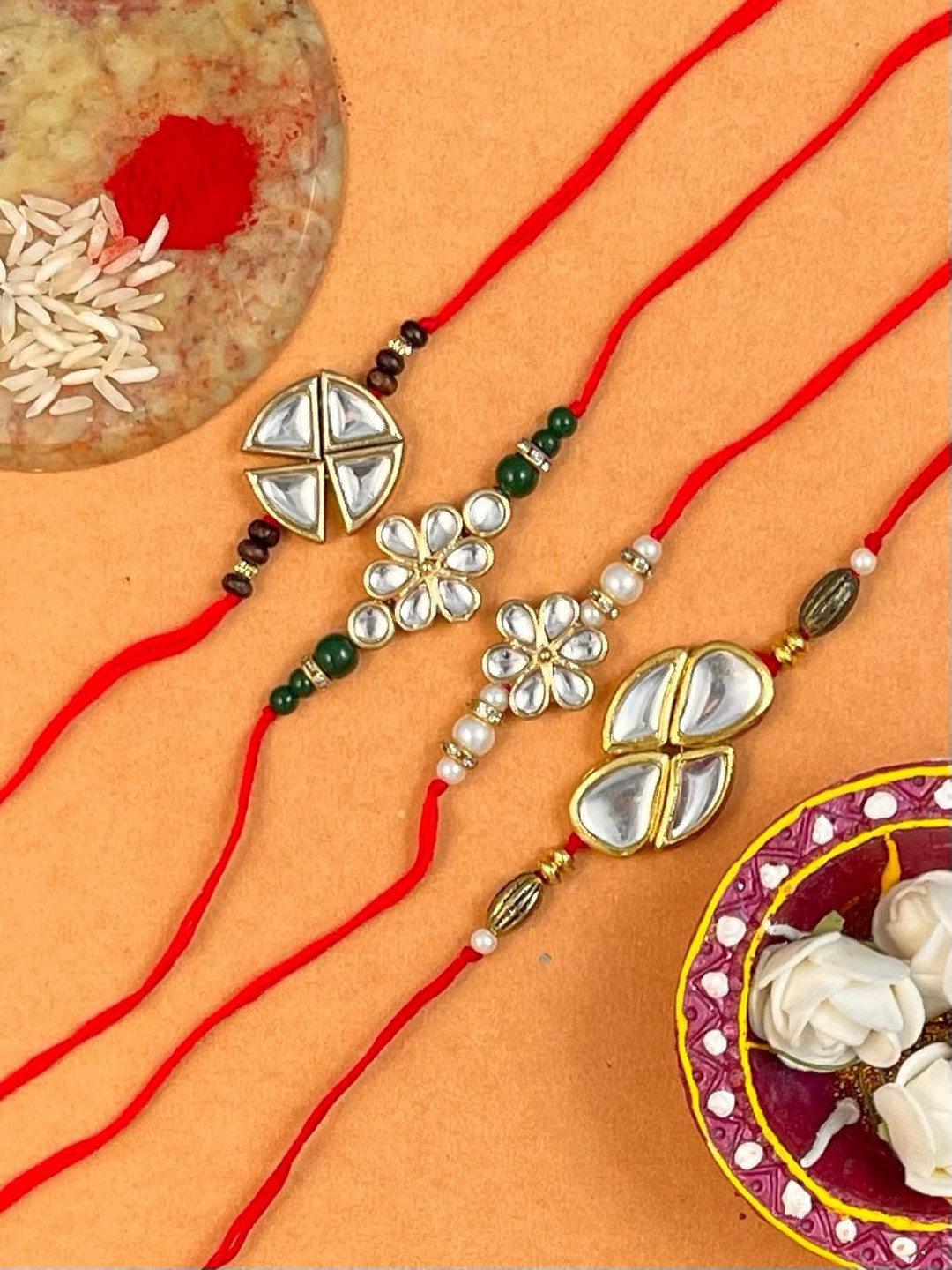

KARATCART Men Set Of 4 Gold-Plated Kundan Studded Rakhi With Roli & Chawal