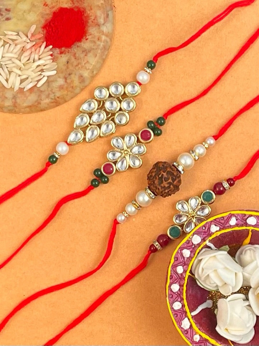 

KARATCART Set Of 4 Gold Plated Kundan Rakhi Combo With Roli & Chawal
