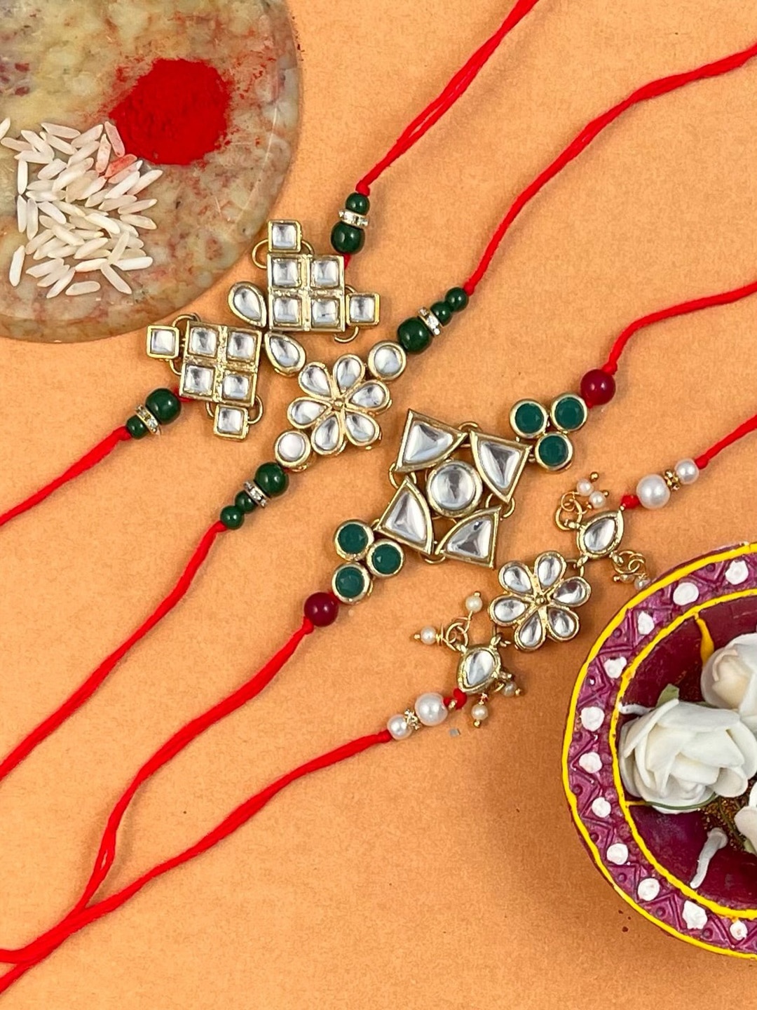 

KARATCART Men Set Of 4 Gold-Plated Kundan Studded Rakhi With Roli & Chawal
