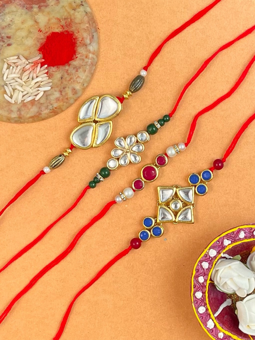 

KARATCART Men Set Of 4 Gold-Plated Kundan Studded Rakhi With Roli & Chawal