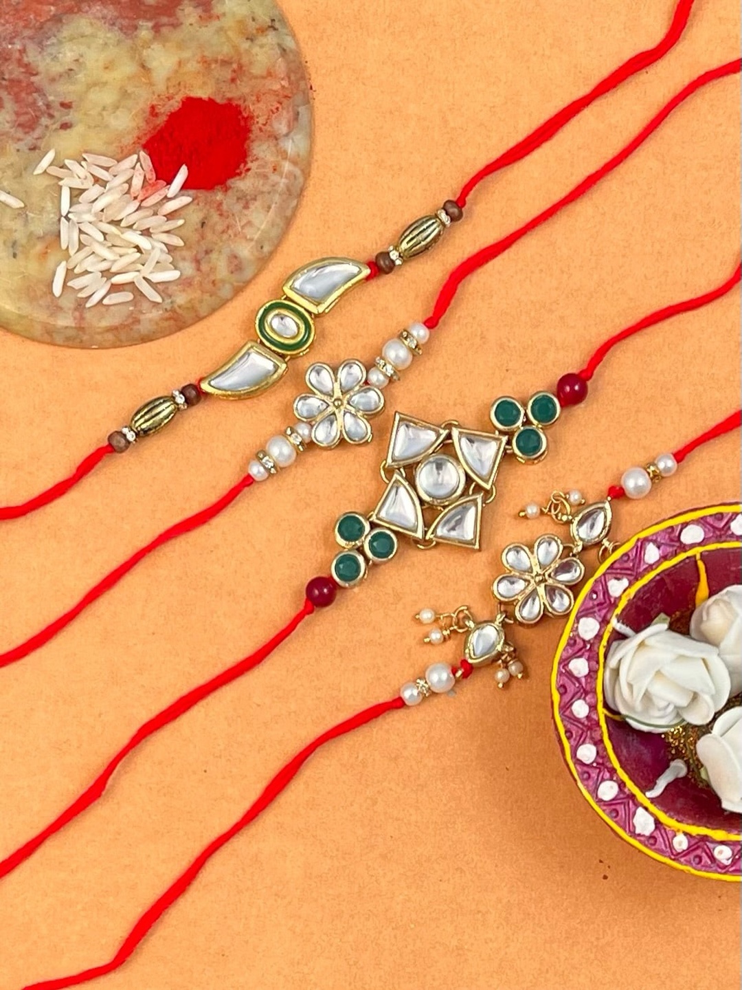 

KARATCART Men Set Of 4 Gold-Plated Kundan Studded Rakhi With Roli & Chawal