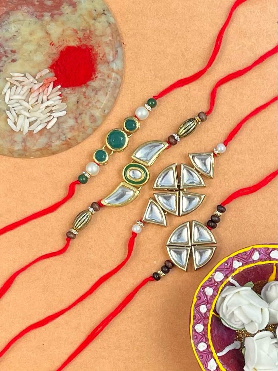 

KARATCART Men Set Of 4 Gold-Plated Gold-Toned Kundan-Studded Rakhi With Rolichawal