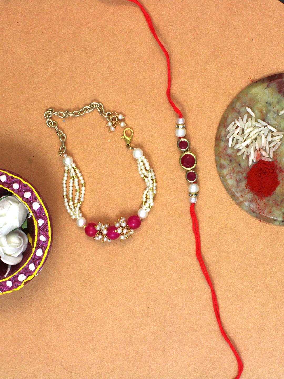

KARATCART Set of 2 Gold-Plated Pink And Red Kundan Rakhi with Roli & Chawal