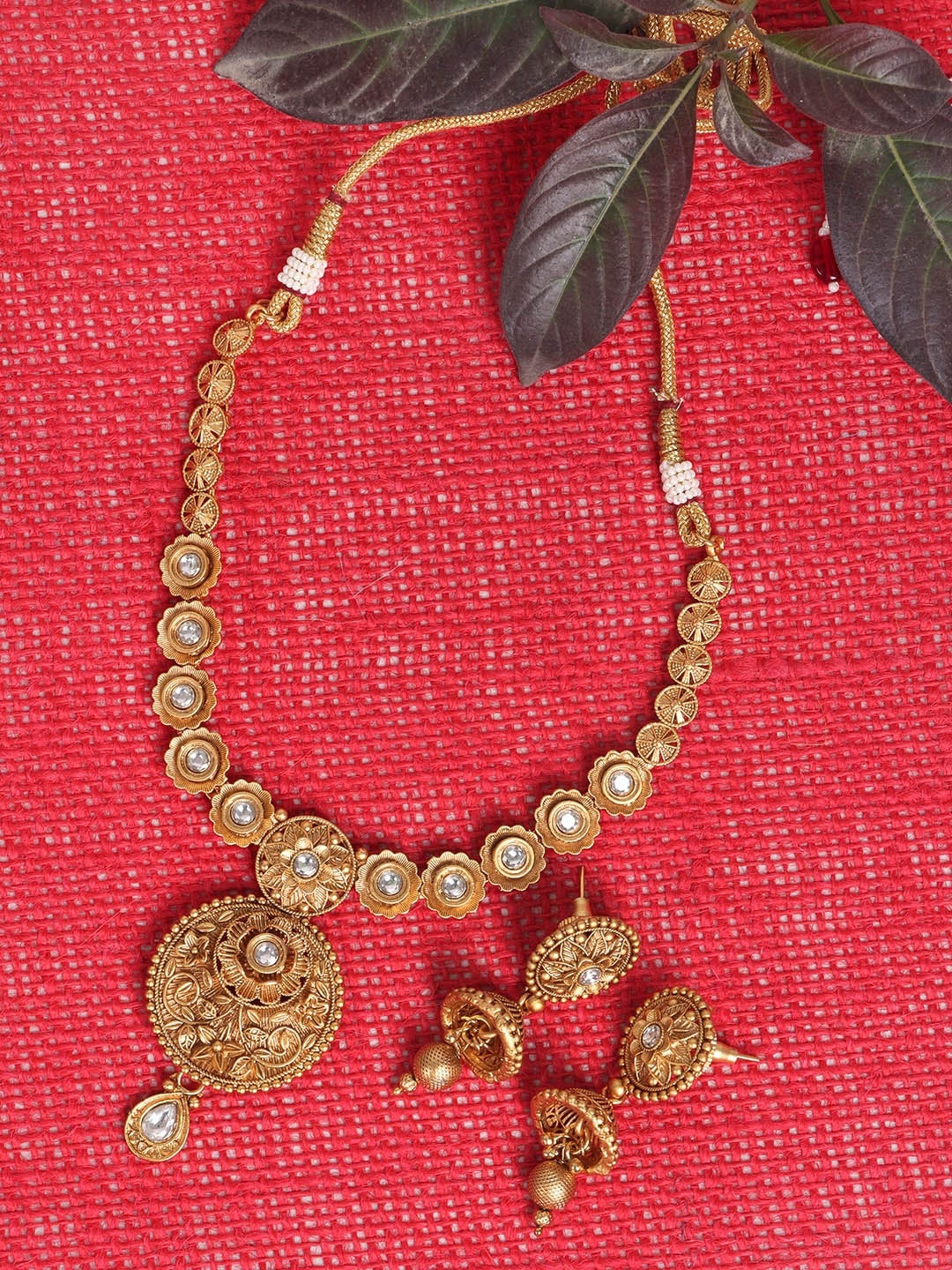 

JEWELS GEHNA Gold Plated & Toned AD Studded Handcrafted Jewellery Set