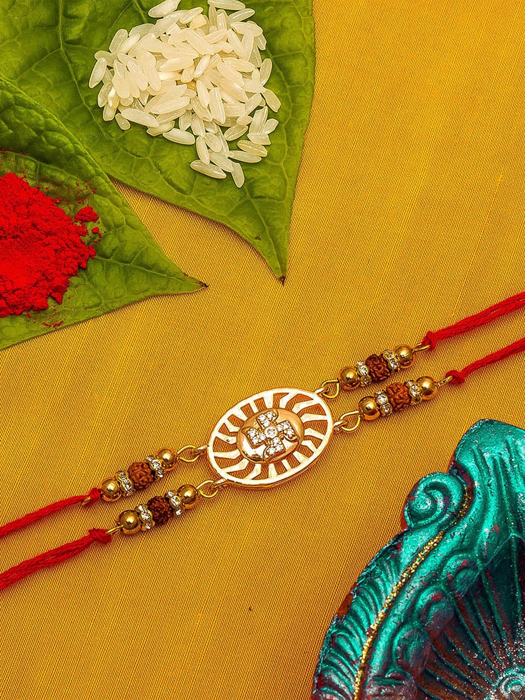 

aadita Men Gold-Toned AD Studded Swastik Rakhi With Roli Chawal