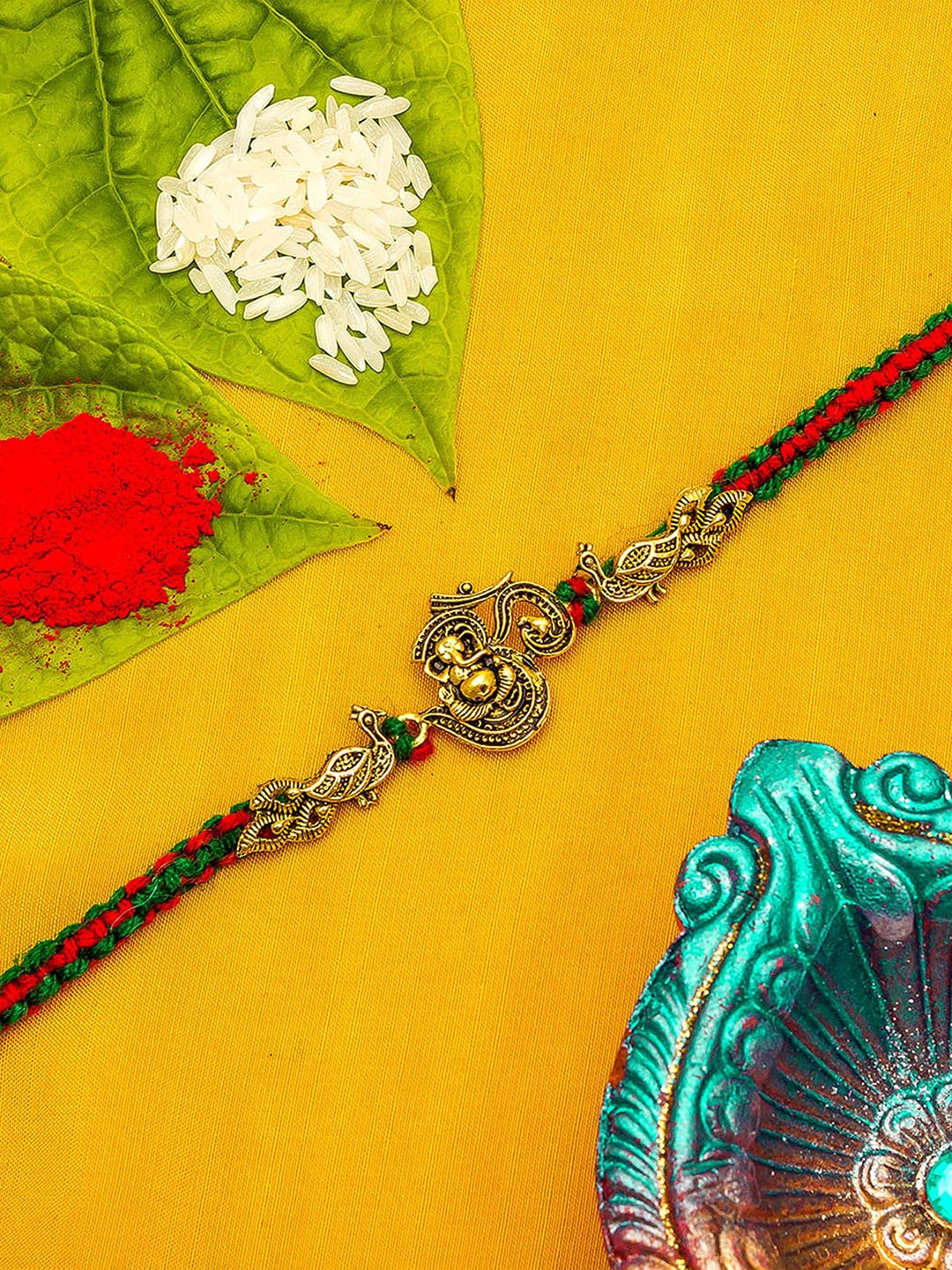 

aadita Men Gold-Toned & Red Stones -Studded Lord Ganesha Rakhi