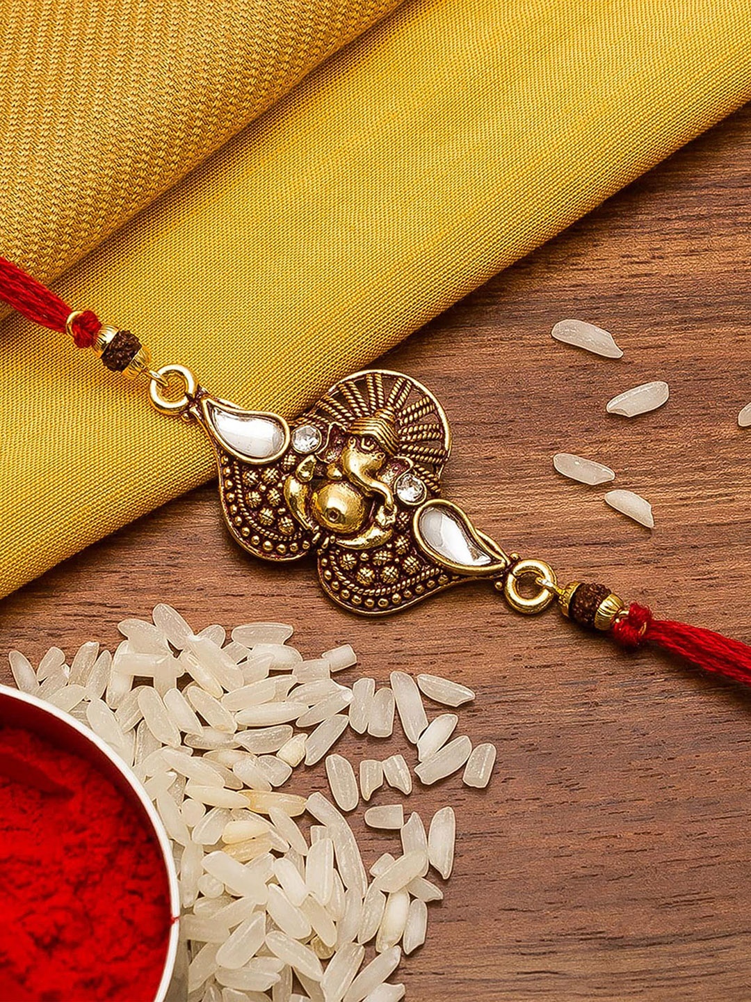 

Aadita Gold-Toned Stones String Handmade Rakhi