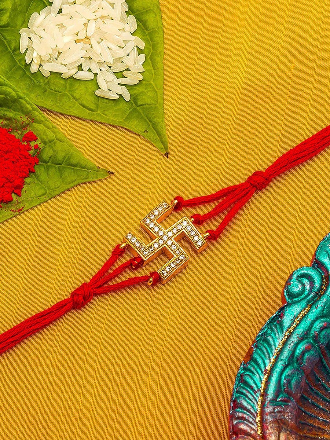 

aadita Red & Gold-Toned Stone-Studded Rakhi