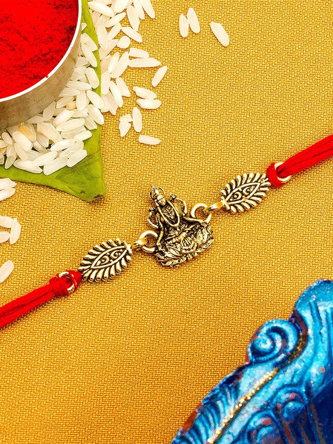 

Aadita Gold-Toned & Red String Rakhi with Roli Chawal