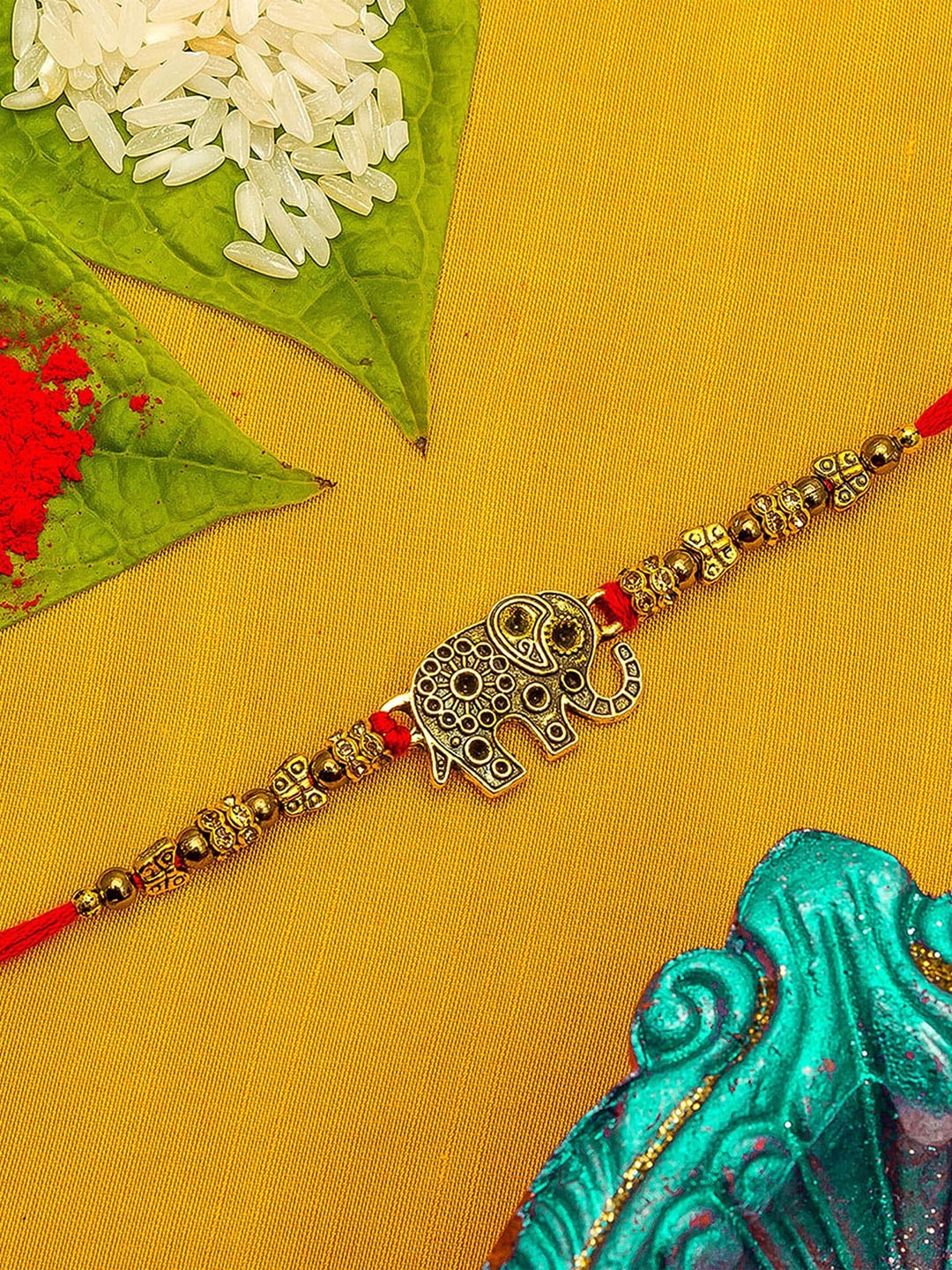 

aadita Men Red, Gold-Toned Stone Studded Elephant Rakhi