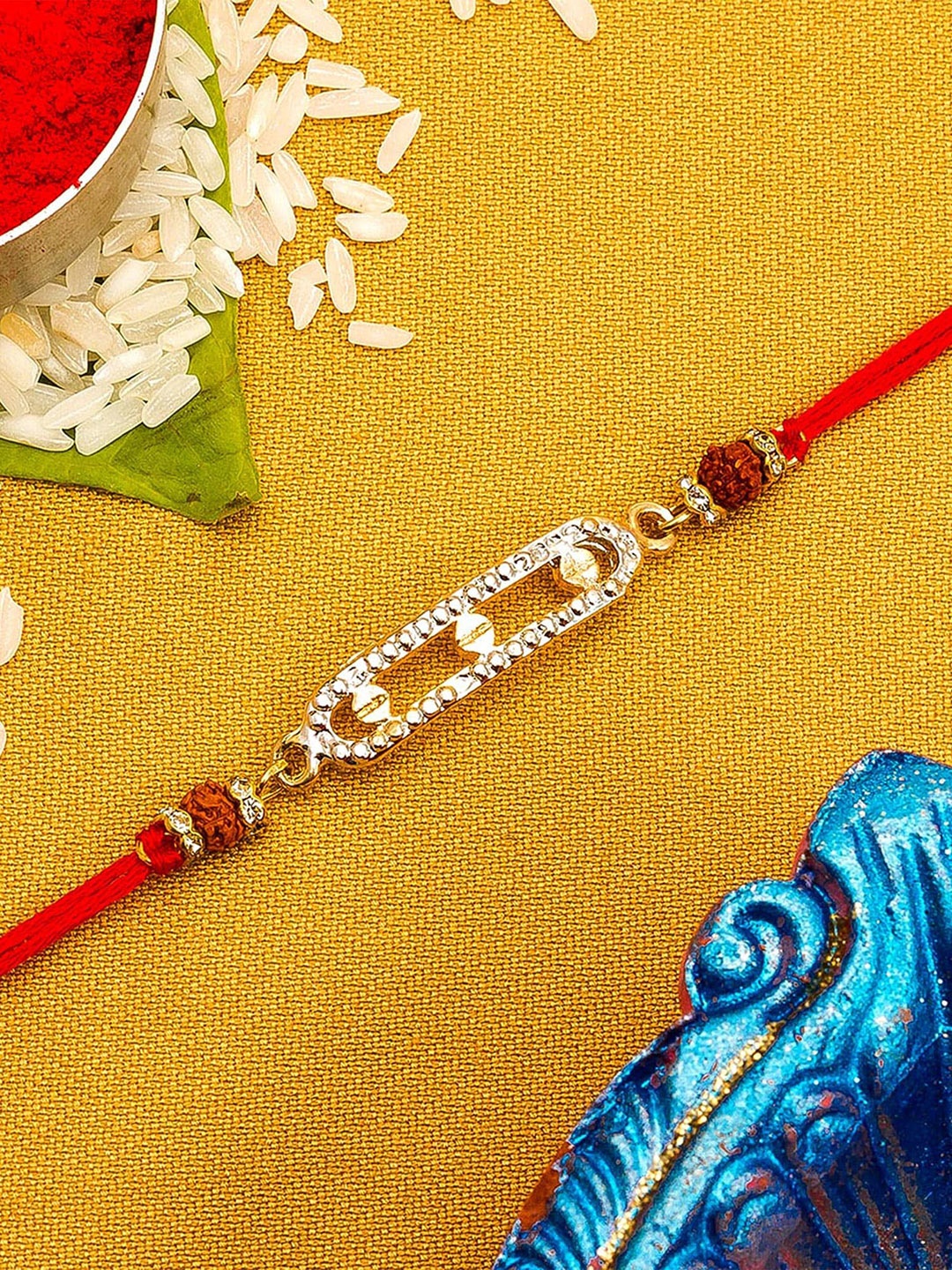 

aadita Gold Toned Stones Studded String Rakhi