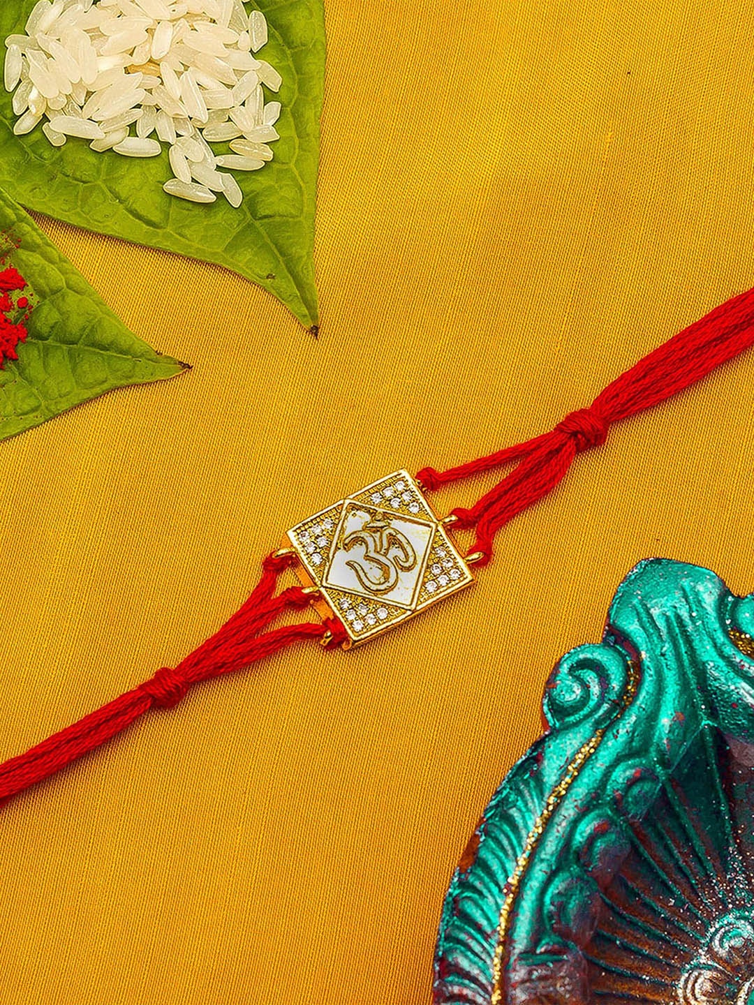 

aadita Gold-Toned & Red Studded Rakhi