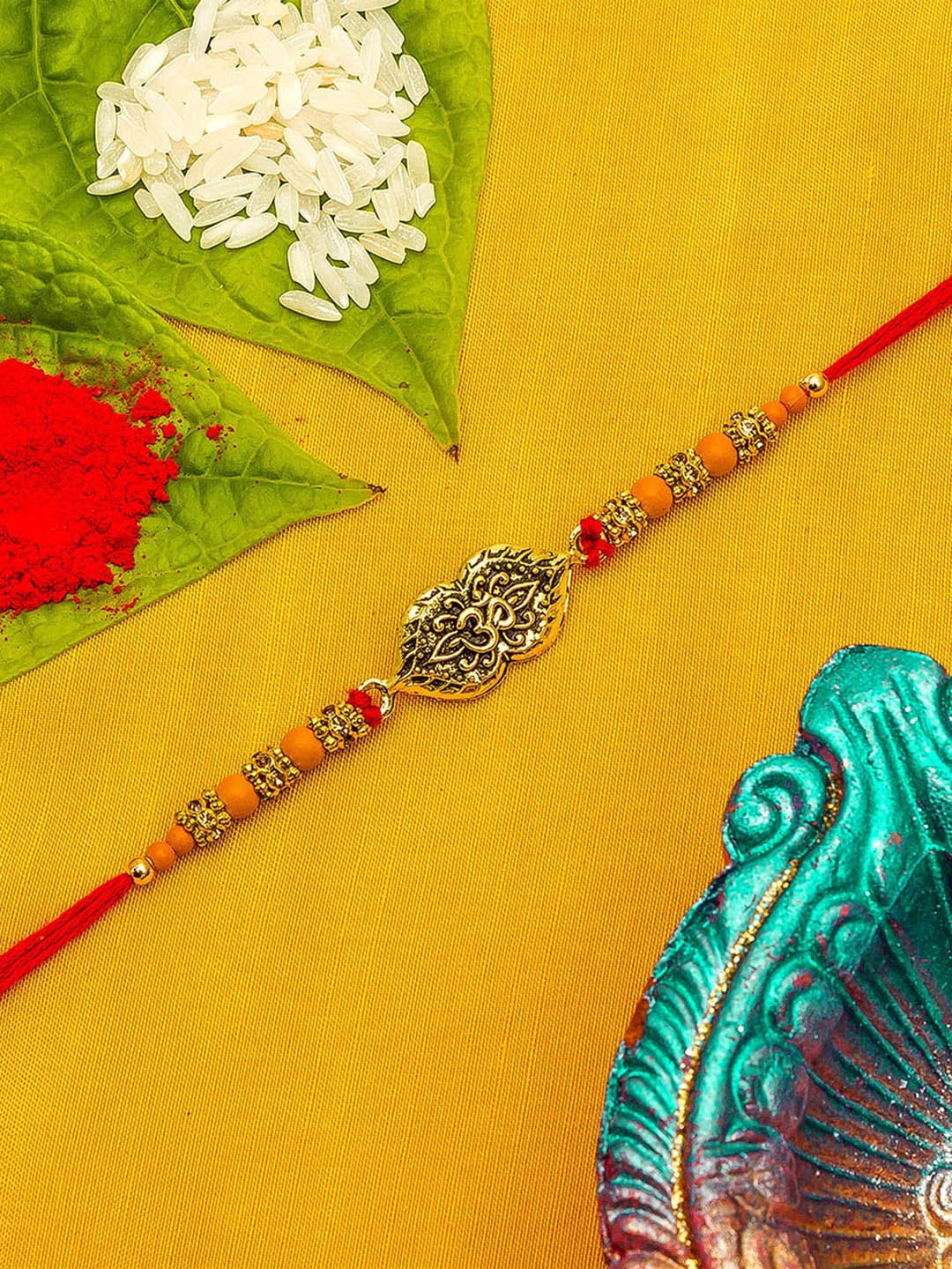

aadita Men Gold-Toned & Red Beaded Rakhi