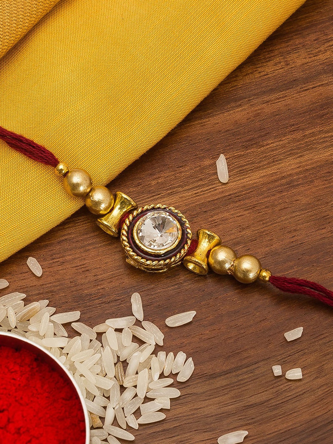 

aadita Men Gold-Toned & White Stone Studded Handmade Rakhi