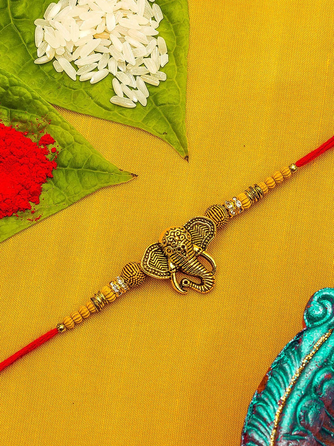 

aadita Gold-Toned Stones String Handmade Rakhi