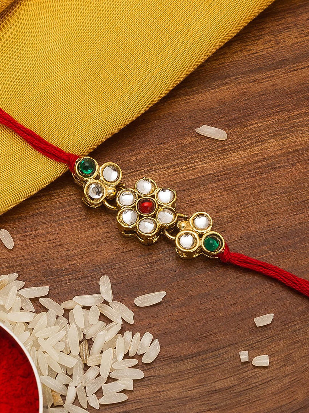 

aadita Gold Toned & Red Stone Beaded Handmade Rakhi
