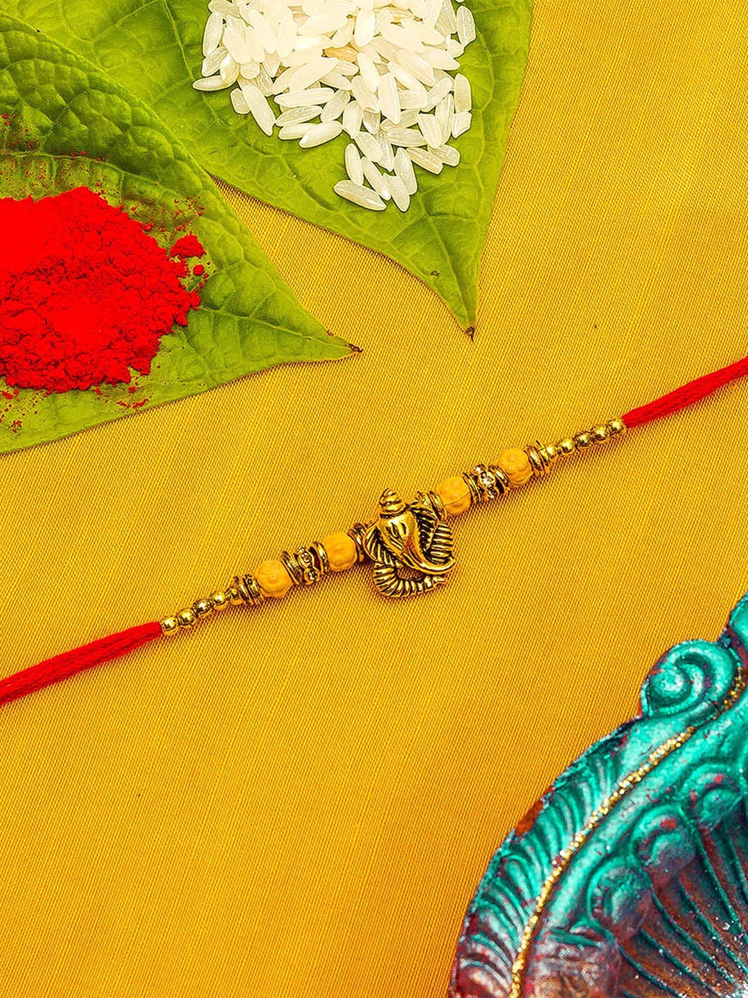

aadita Men Red & Gold-Toned Lord Ganesh Beaded Rakhi